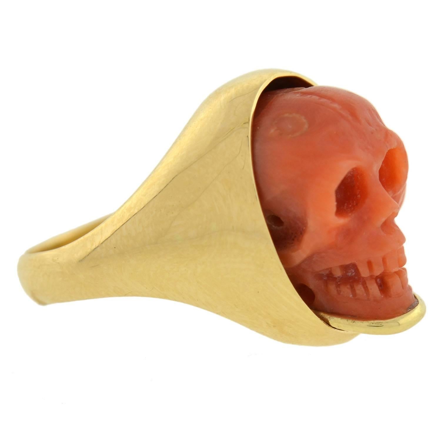 This fabulous ring pairs a Victorian (ca1880) era coral skull with a handmade 18kt gold setting, creating a fantastic compilation piece! The natural coral is meticulously hand carved, creating a detailed miniature replica of a human skull. The