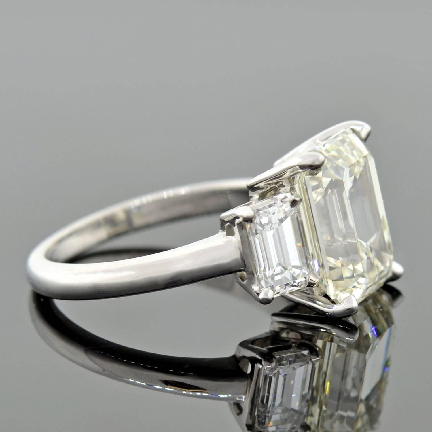 Contemporary 4.13 Carat Emerald Cut Diamond Platinum 3 Stone Engagement Ring  In Excellent Condition In Narberth, PA