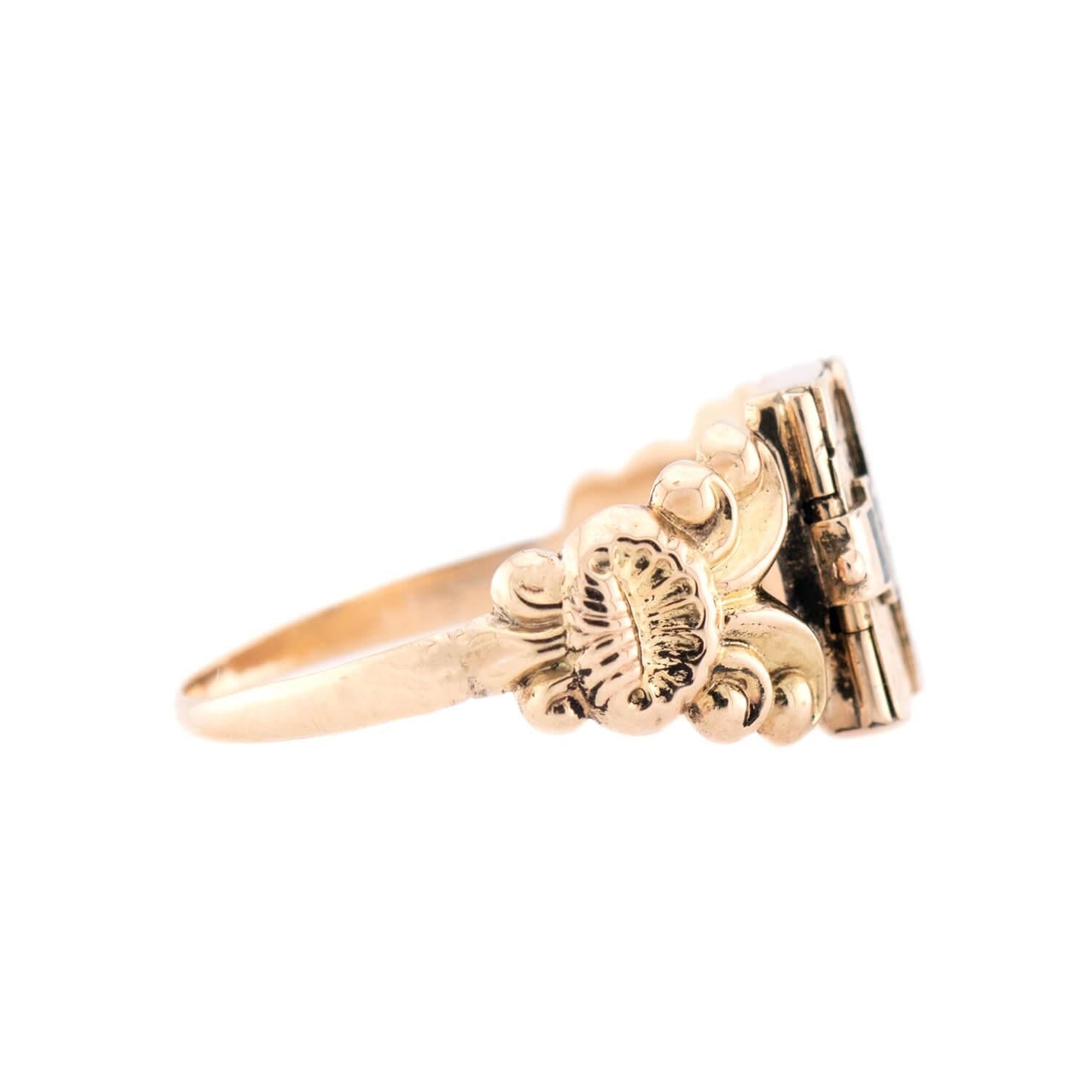 A spectacular and very rare locket ring from the Georgian (ca1750s) era! This unusual ring which is crafted in vibrant 18k yellow gold, and features an envelope-motif centerpiece. The envelope is decorated with beautiful black enameling, and opens