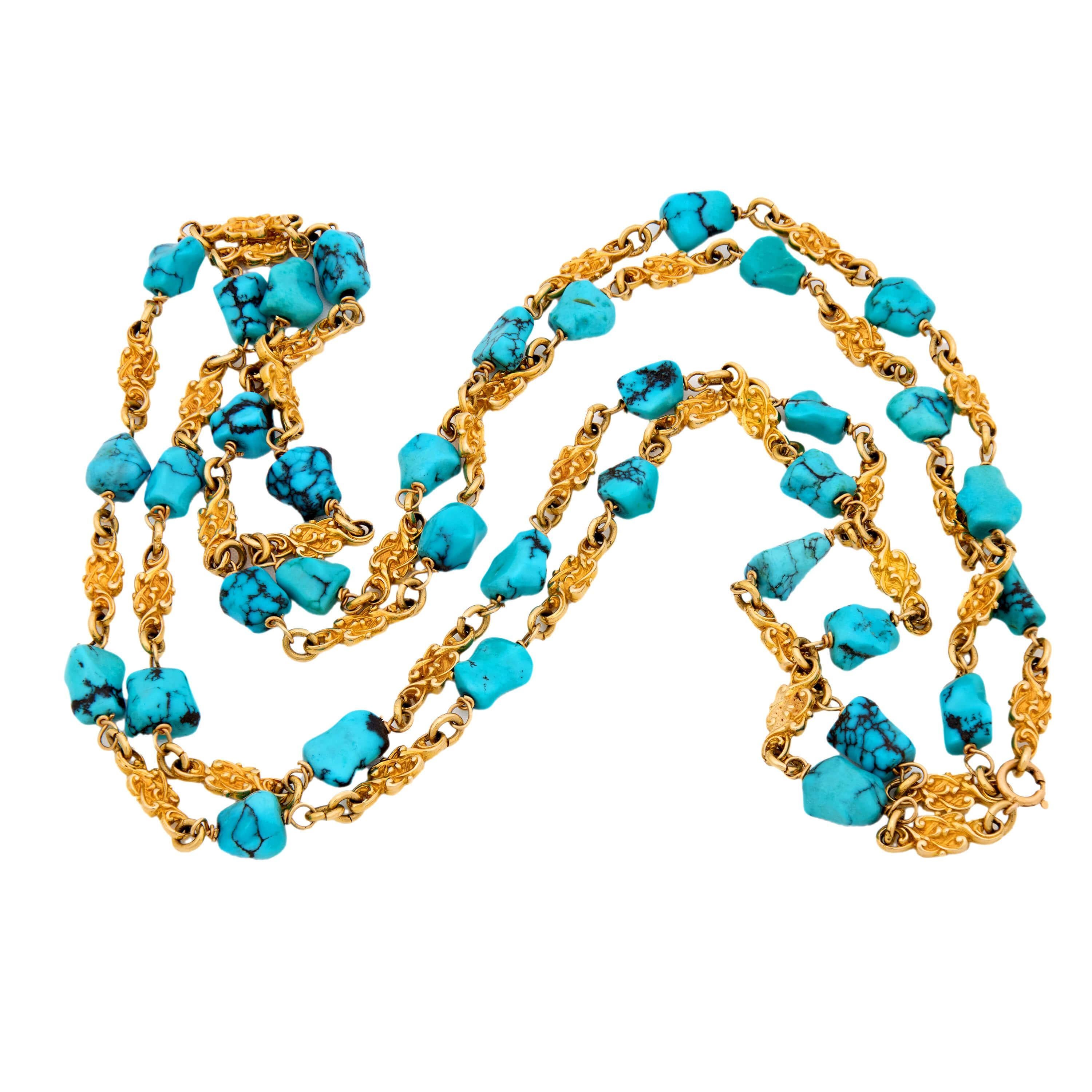 A wonderful turquoise necklace from the Victorian (ca1880s) era! Crafted in 14k yellow gold, this necklace is comprised of vibrant knot-motif links. The links are intricately carved, and are connected by jump rings to turquoise nuggets. All of the