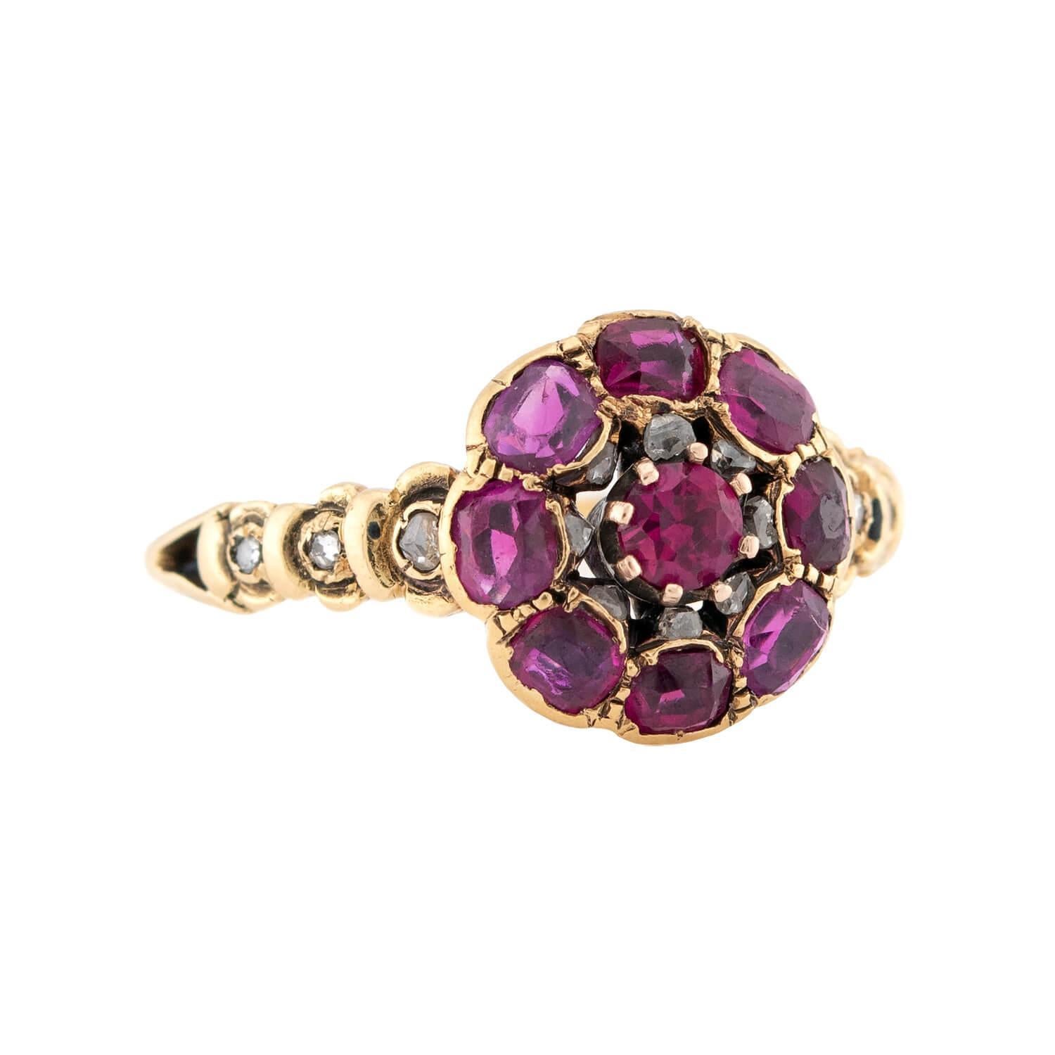 A gorgeous ruby and diamond cluster ring from the Georgian (ca1750s) era. Crafted in 18k yellow gold, this ring features a cluster of Burmese no-heat rubies. The central ruby is held within a prong-setting, and the surrounding rubies are bead-set.