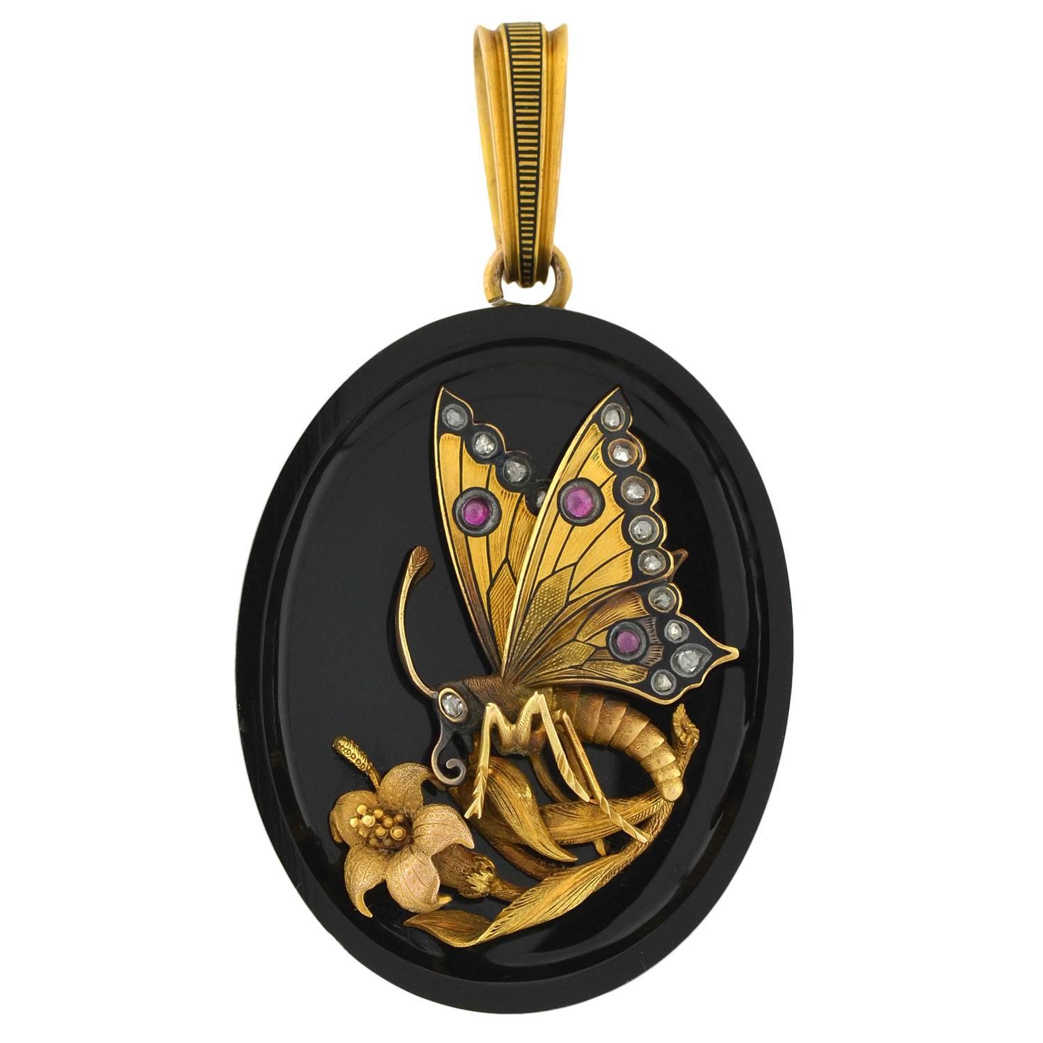 An absolutely magnificent 15kt gold and onyx locket/pendant from the Victorian era! This gorgeous and very unusual piece has a solid onyx face and a 15kt gold case. The locket has an oval shape and is particularly large in size. The onyx plaque has