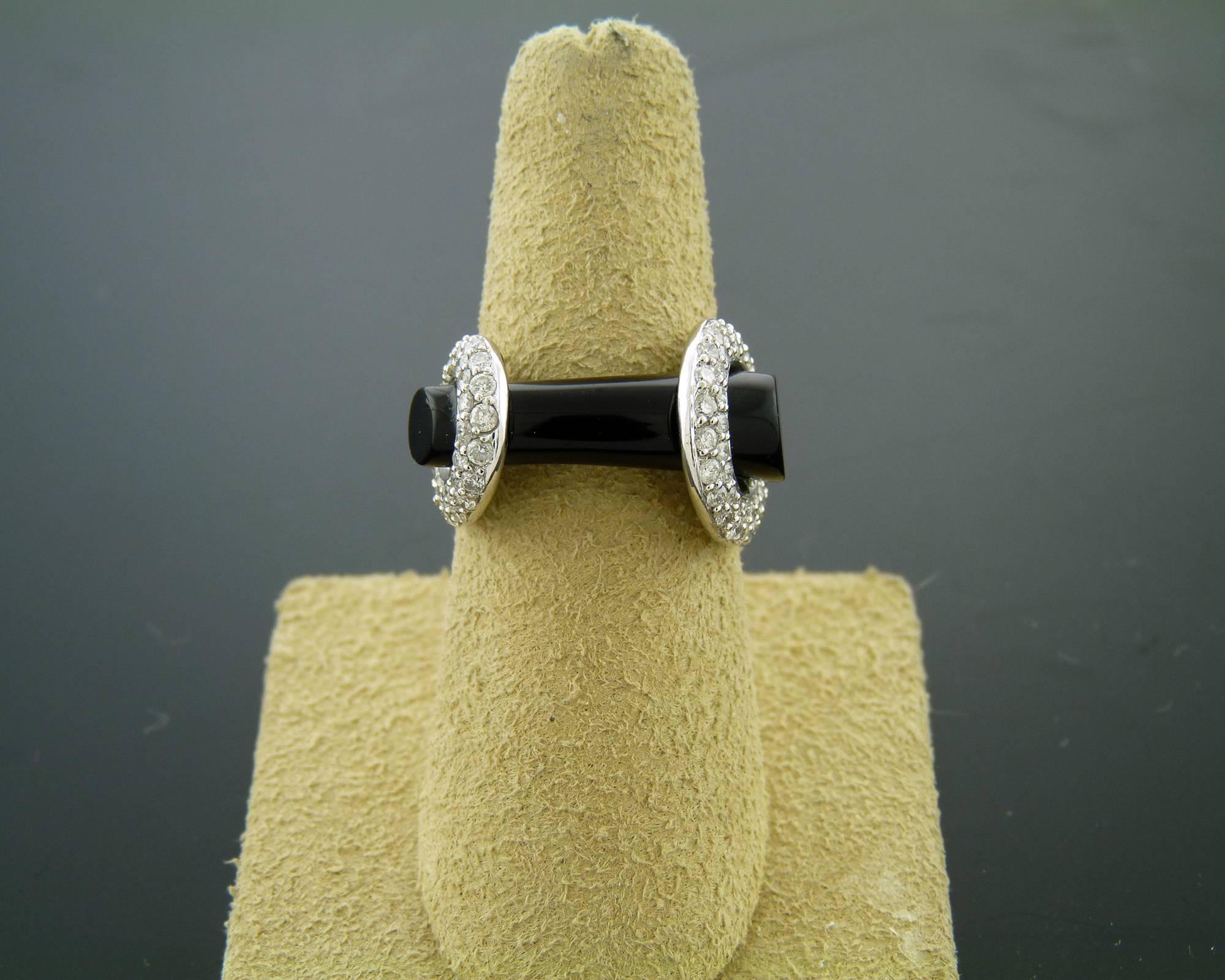 Onyx and Diamond White Gold Ring by Adamas.
Adamas is a fabulous Italian jewelry brand with very chic high-end jewelry, the brand that keeps up with tradition while remaining fresh and innovative.
This modern unsymmetrical 'nougat' design ring