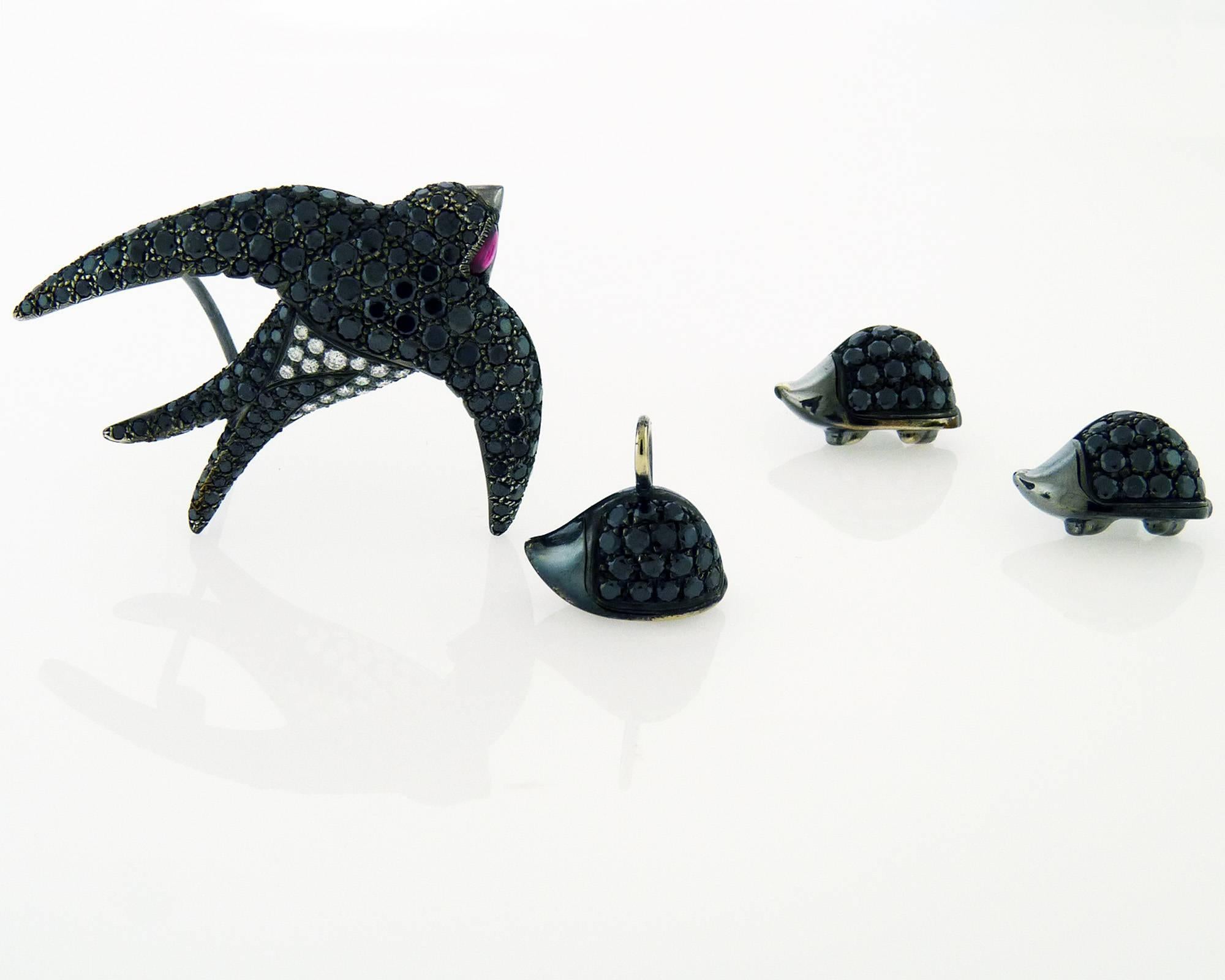 A cute black diamond earrings, pendant, and brooch set, by De Grisogono.
The set consists of hedgehog design earrings and pendant,  and a seagull brooch.
The earrings and pendent are set with black diamonds in rhodium black gold on top of silver.