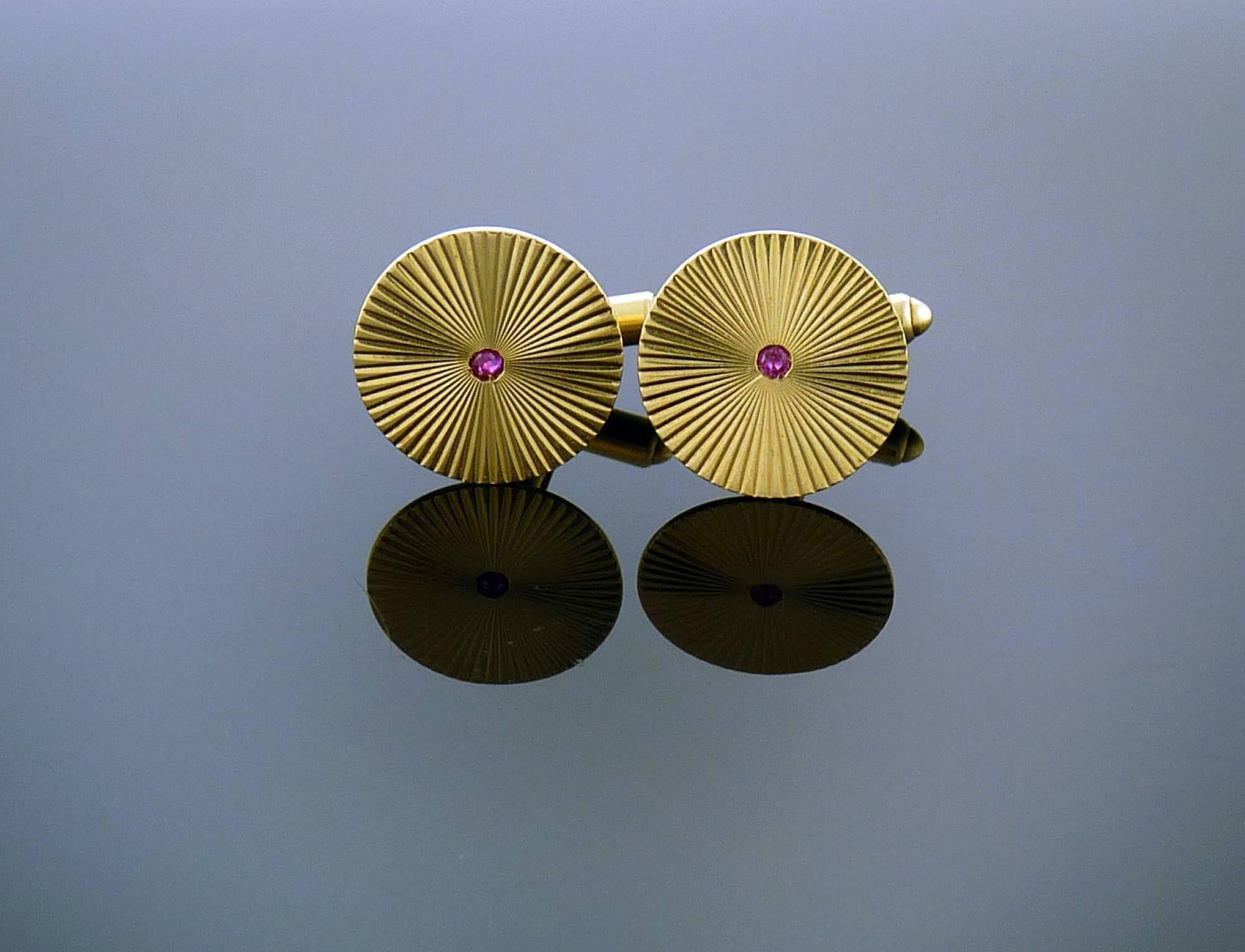 This Stunning Ruby centered Cuff-links are mounted in 14K Yellow Gold.

A perfect touch to any outfit!