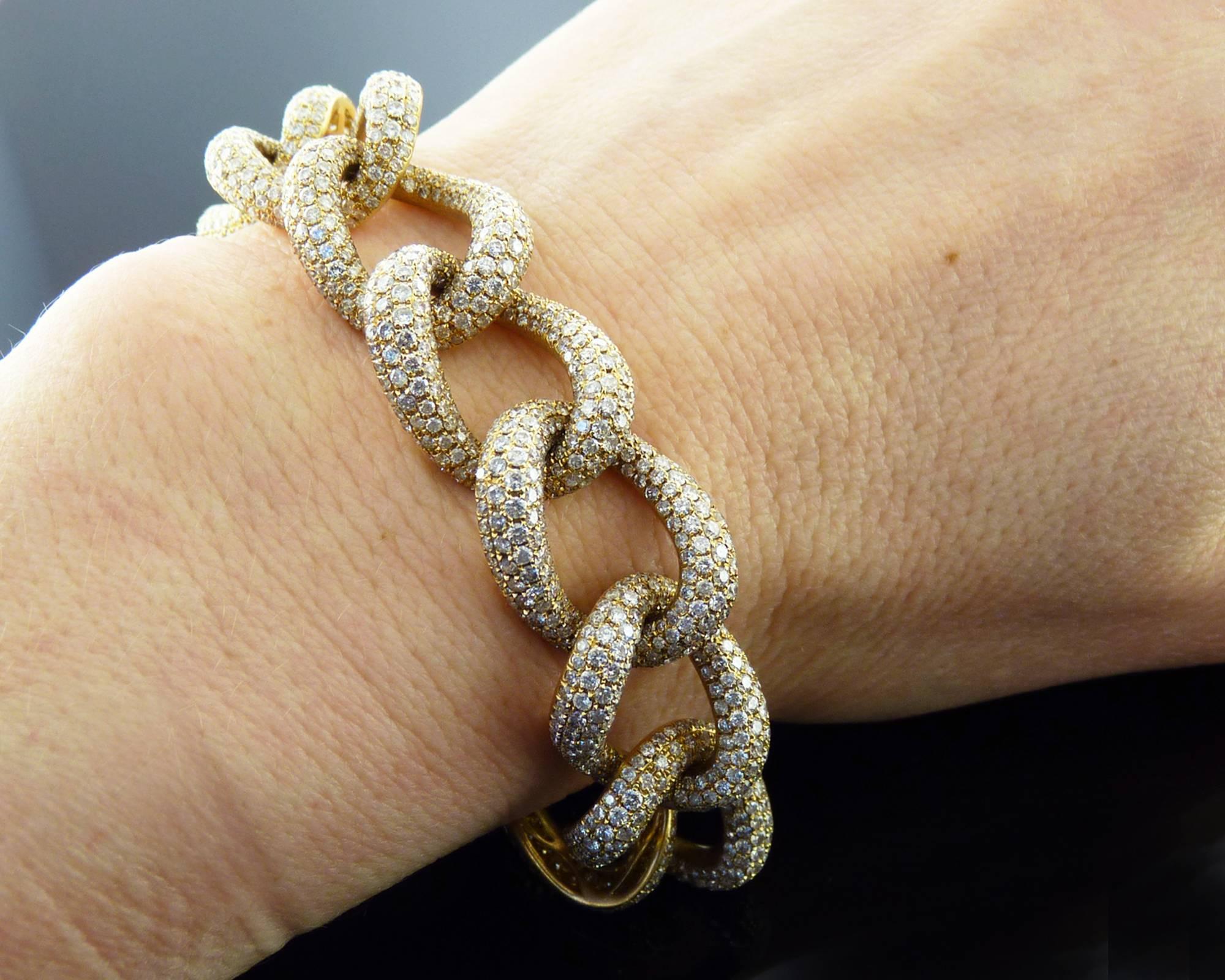 A beautiful and wearable link bracelet featuring pave diamonds on the face of the bracelet. 
Approximate weight of diamonds is 6-8 carats, most with G-H color, VS-SI clarity.
Metal is 18kt yellow gold.
Measurements:
8 inches long;
0.6 inches