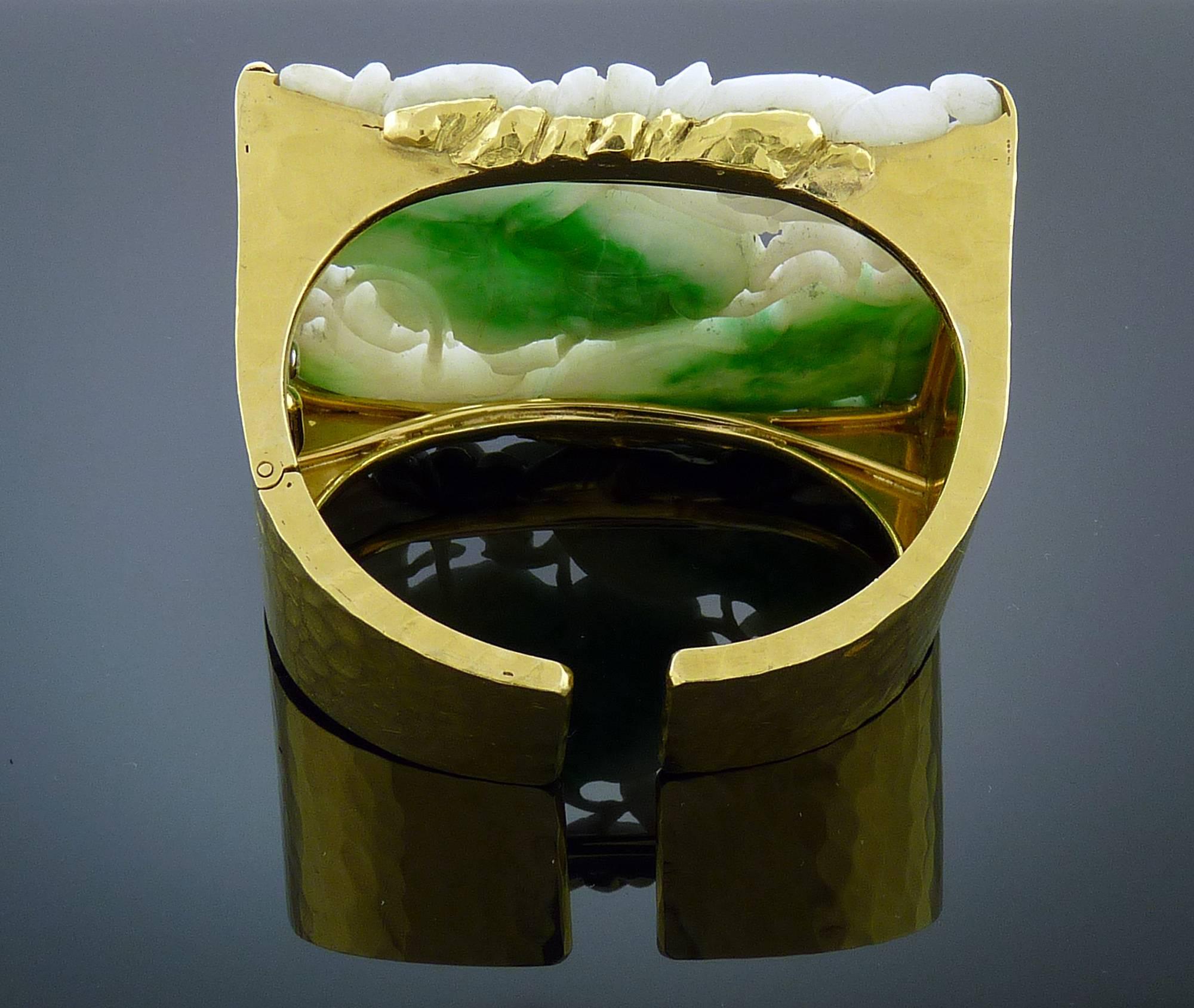 Designed as a tapered hinged 18k gold textured cuff, centered a rectangular shaped Jade carving (measuring approximately 2.5in x 1.75in)
Mounted in 18k Yellow Gold.
Signed Webb for David Webb.