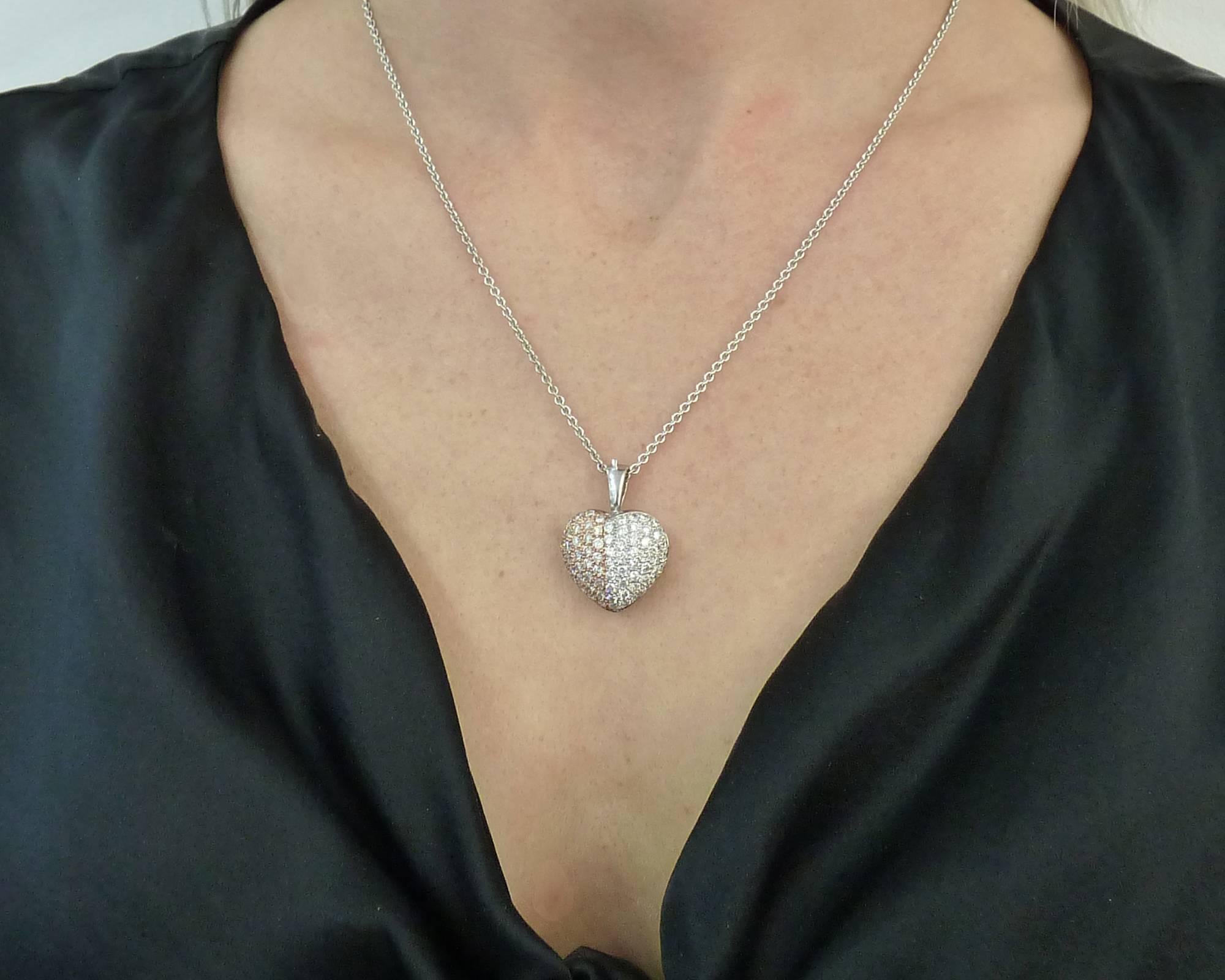 Introducing a stunning Contemporary Heart-Shaped Diamond Pendant Necklace that exudes elegance and charm. This exquisite piece features diamonds totaling approximately 3.30 carats, adding a brilliant and captivating sparkle. Crafted with precision,
