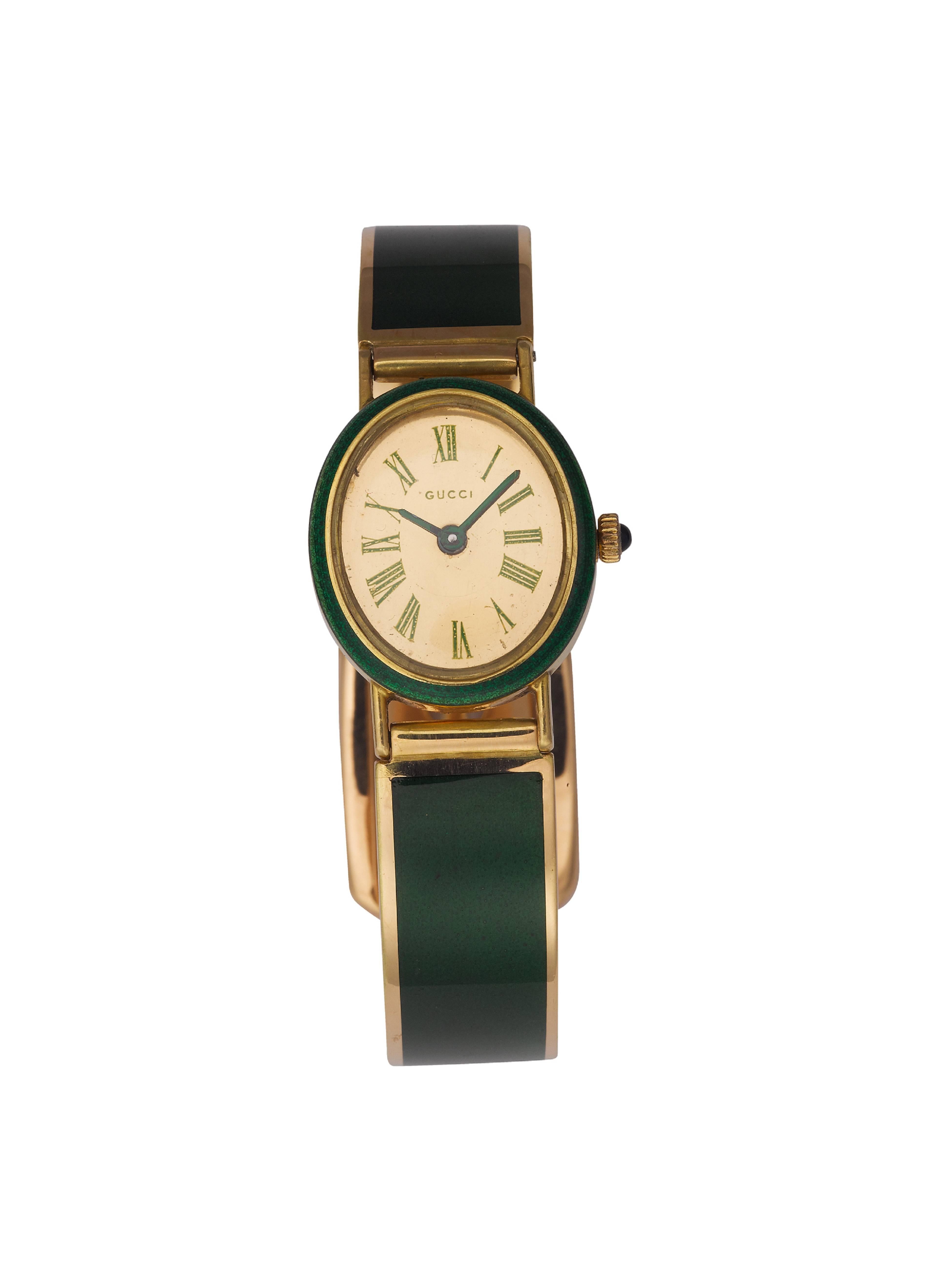 18K Gold, Green Enamel and Cabochon Sapphire Bangle Watch. **Hallmarks: No. 33708 18K 750 Gucci Italy **Face: Gucci