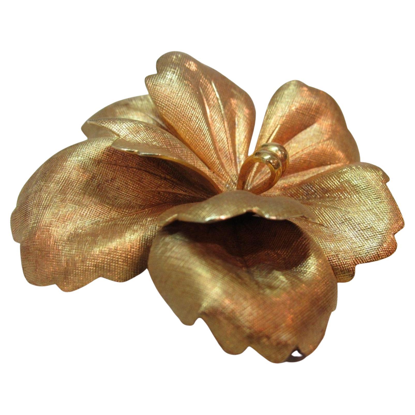 Lovely Tiffany & Co. large Orchid brooch in 14K yellow gold. The petals are finely detailed and dimensional - just gorgeous. This is a classic & timeless piece perfect for day or night.

Lovely Tiffany & Co. large orchid brooch in 14K yellow gold.