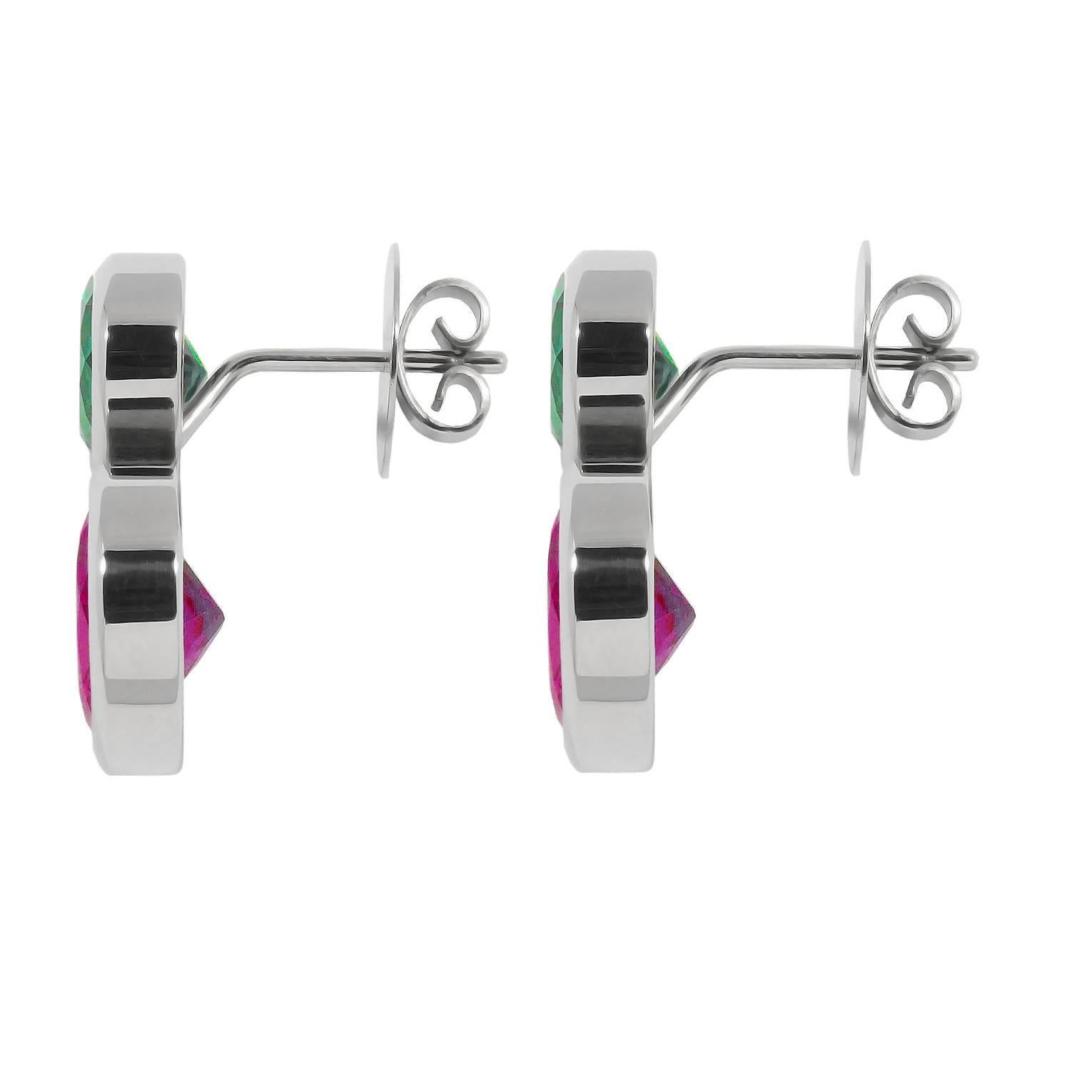 Two beautiful vibrant colors are mixed up in these 18k white gold earrings. With its perfect length of 22 mm they are wearable every day. The green tourmalines have a weight of 5.4 ct and the rhodolite 12.36 ct. Designed by Colleen B. Rosenblat.