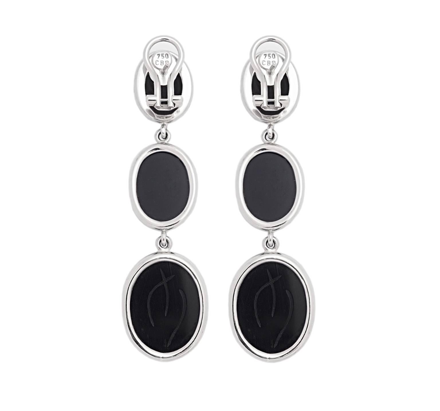 A pair of scarab earrings in 18k white gold with six desirable deep black onyx.
This creation was designed by Colleen B. Rosenblat.
