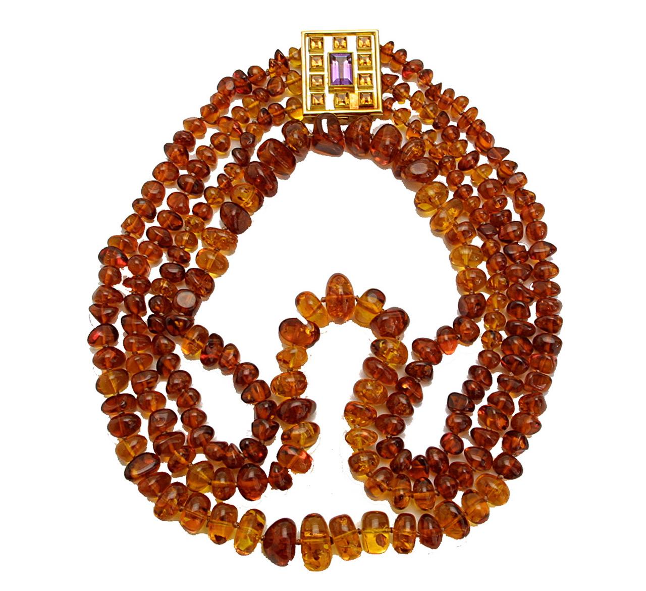 This amazing 3 row amber necklace with a 22 carat yellow gold close with amethyst and cirtine 7.2 ct
This nacklace is hand made by Colleen B. Rosenblat. 
Item Specifics
Length: inside 56 cm outside: 71 cm
Width: 3-4 cm
Gold close: 3 cm x 3.5 cm