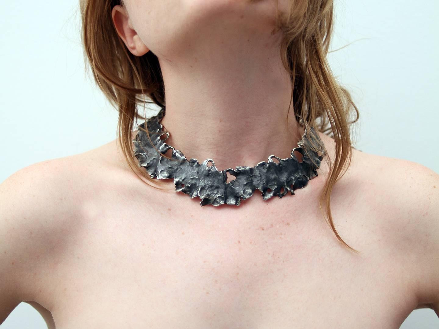 Oxidised sterling silver necklace. Edition 2 of 20 

The collection of Miquel Barceló came to life in 2007 through a dialogue between the artist and Chus Burés. These pieces are linked to the artist's iconography and in tune with his serpentine