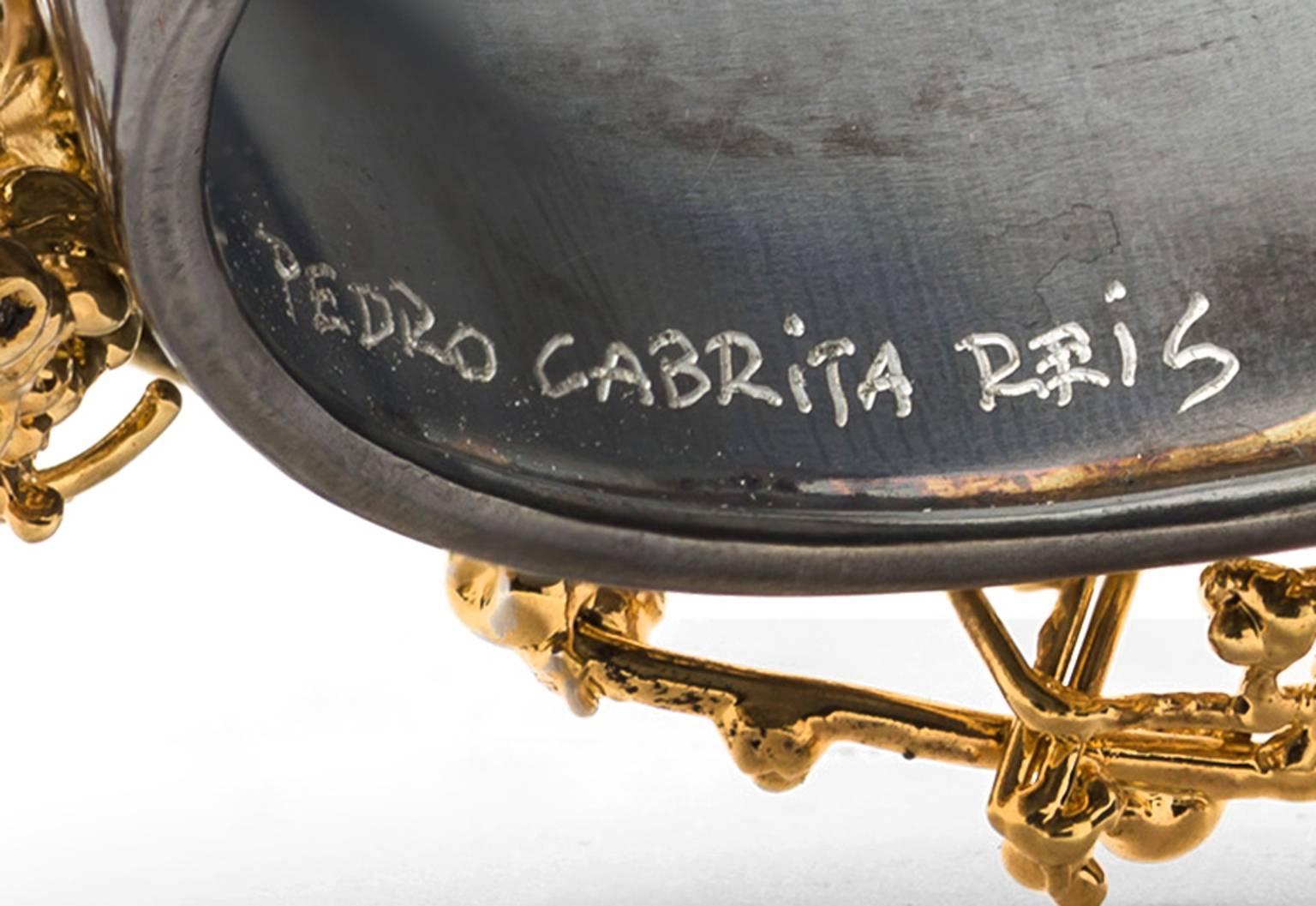 Unique handmade gold plated iron with oxidised silver bangle.

B by Pedro Cabrita Reis is a collection of unique wearable sculptures created by the artist as part of a project conceived for Elisabetta Cipriani gallery.

“There is no difference