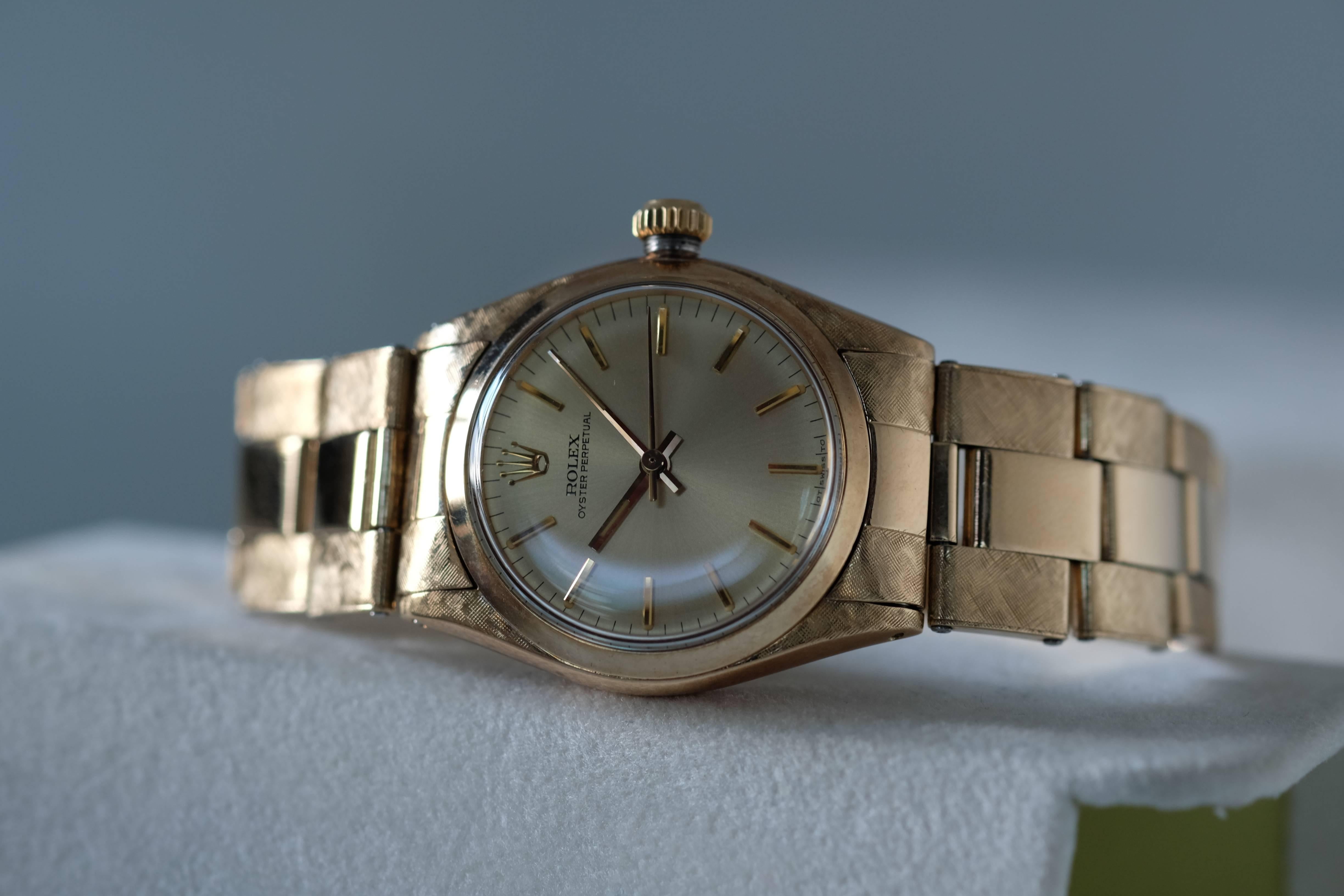 A New Old Stock  Ladies Rolex Oyster Perpetual 14k Yellow Gold with Florentine Finish

Reference: 6551

Circa: 1960s

Movement: Manual-wind Rolex Cal. 1160

Case: 30mm 14k yellow gold with Florentine finish, screw-down case back and crown;