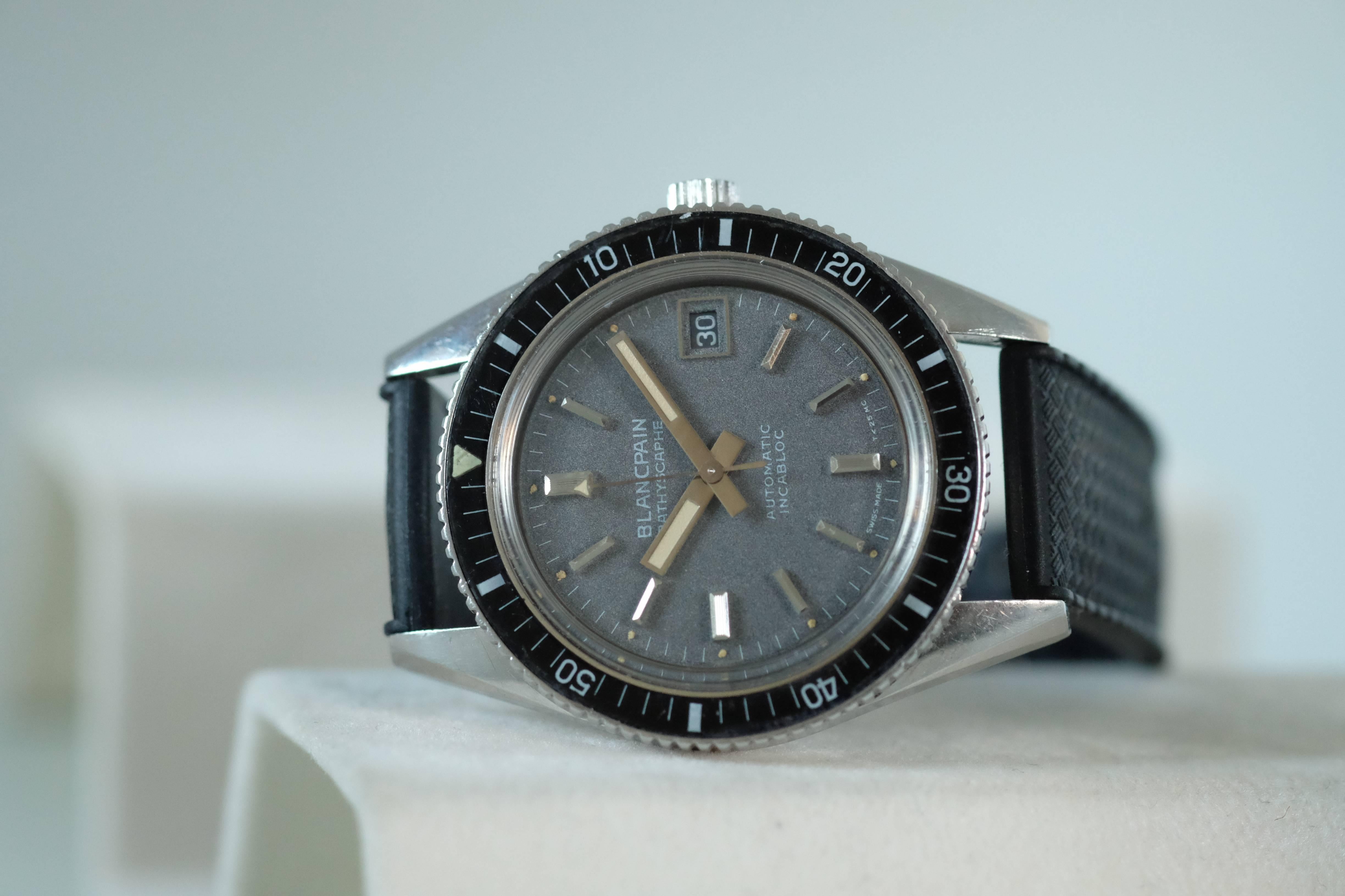 Blancpain. Stainless Steel Diver’s Wristwatch with Center Seconds

Model: Bathyscaphe 

Circa: 1960's

Movement: Automatic movement Rayville calibre AS 1902

Case: Stainless steel circular water-resistant-type case, with screw back and screw