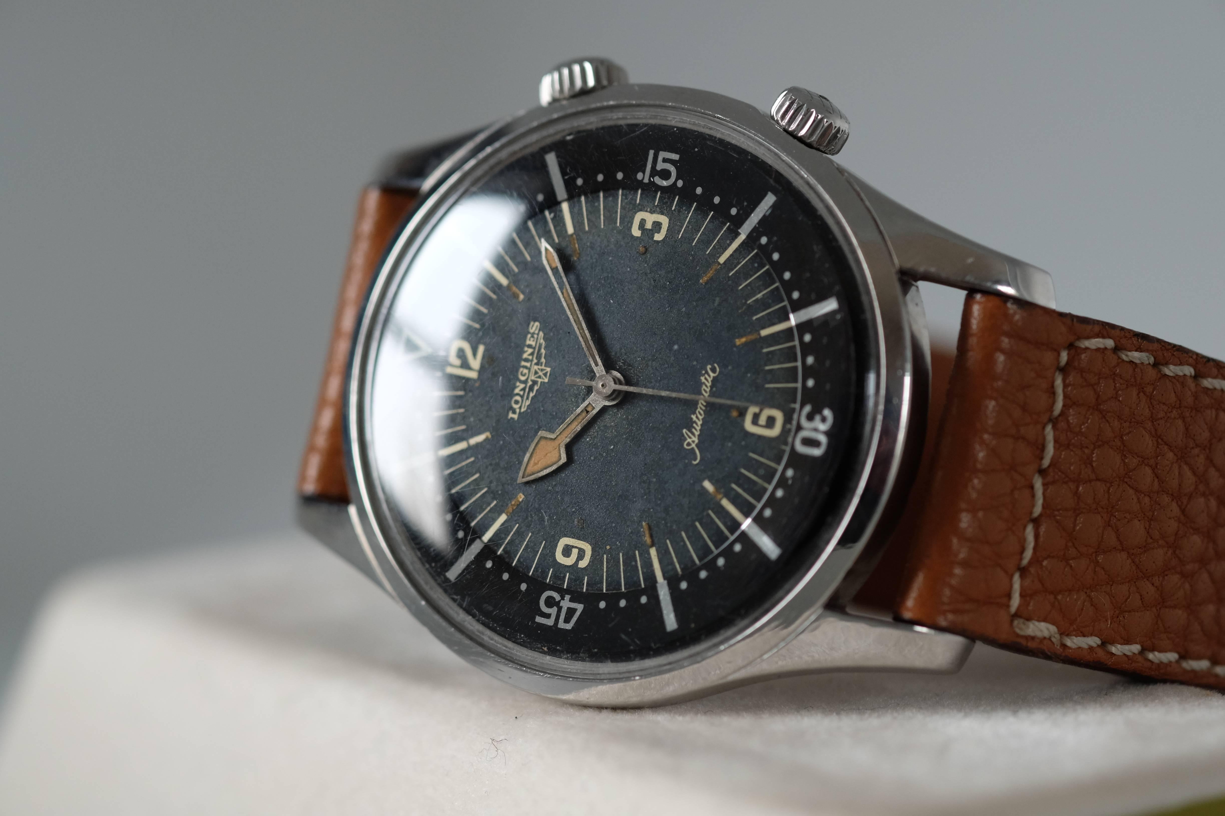 A Stainless Steel Dive Watch from Longines in a Super compressor Case ref 7042

Circa: 1950s 

Movement: 

Case: 40mm; stainless steel compressor case with screw-down case back and crowns

Dial: Black dial with luminous numerals, baton
