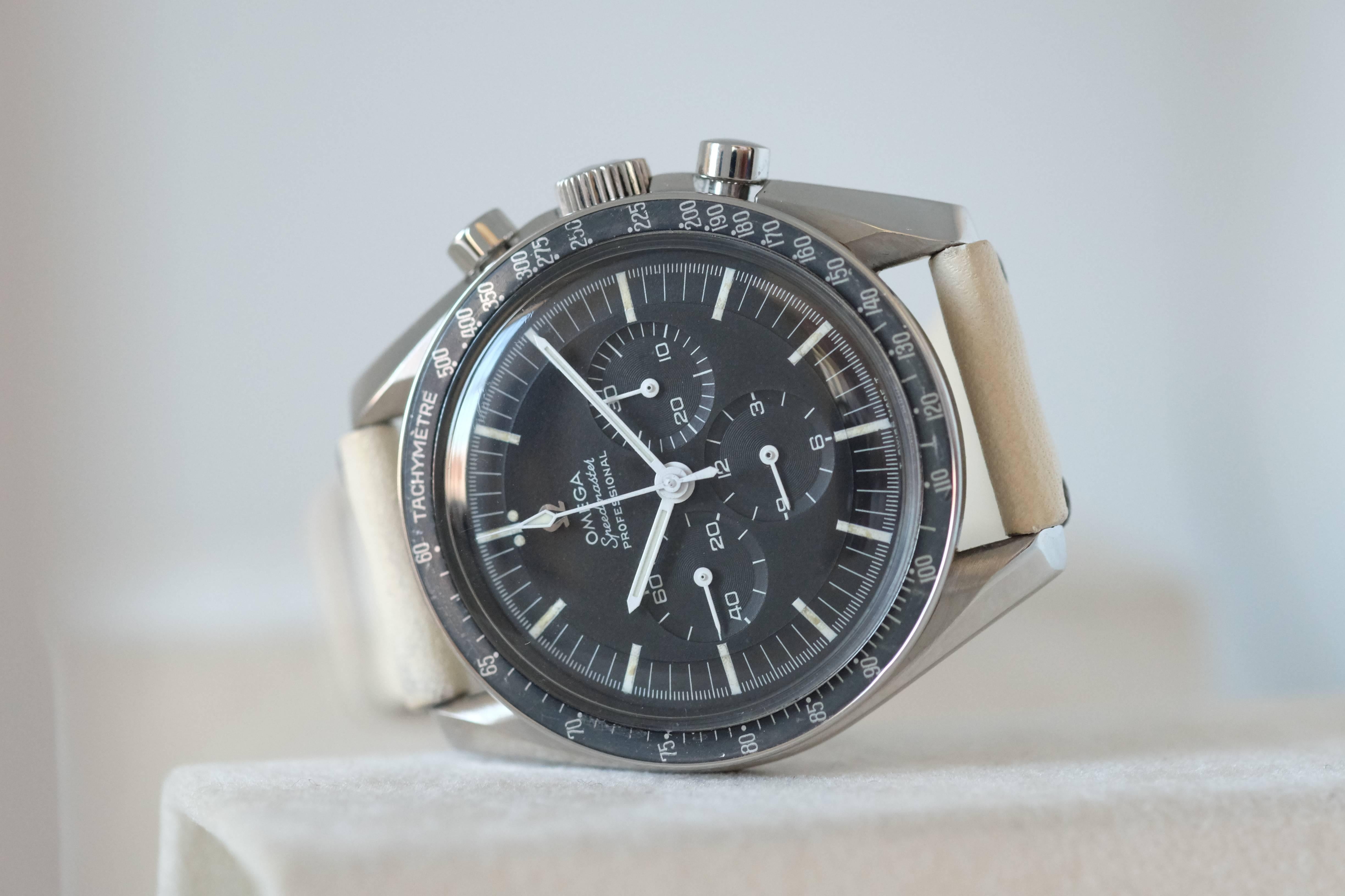 Omega. A Rare Stainless Steel Chronograph Wristwatch

Model: Speedmaster Professional

Reference: 105.012-66 CB

Circa: 1966

Case: Three-body, polished and brushed, screwed-down case back engraved with the Speedmaster logo, tachometer