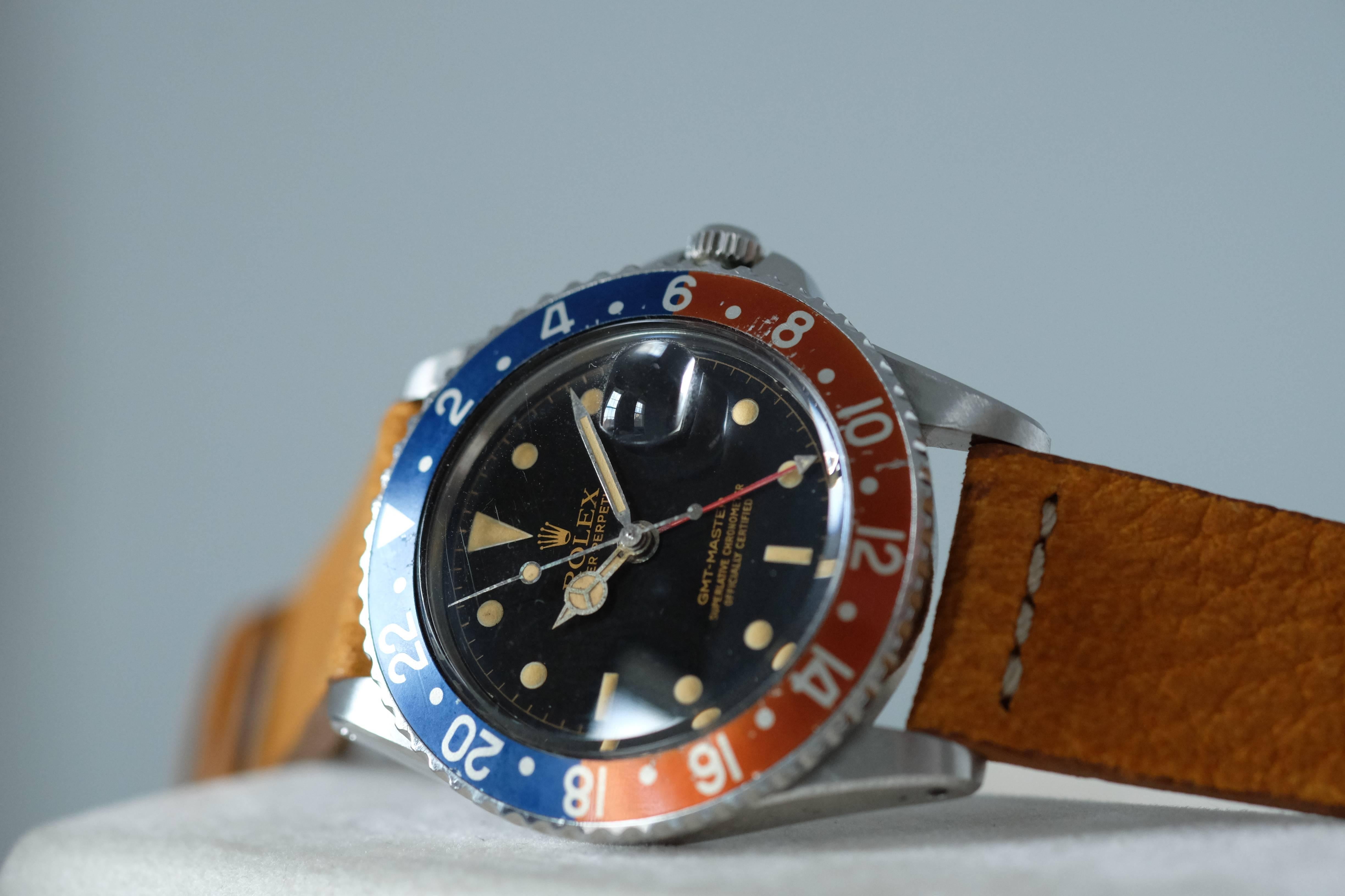 Rolex. A Stainless Steel GMT Wristwatch with Chapter Ring dial and pointy crown guards

Model: GMT-Master

Reference: 1675

Circa: 1961

Case. Three-body, polished and brushed, curved lugs, screw down case back and crown, Twin lock