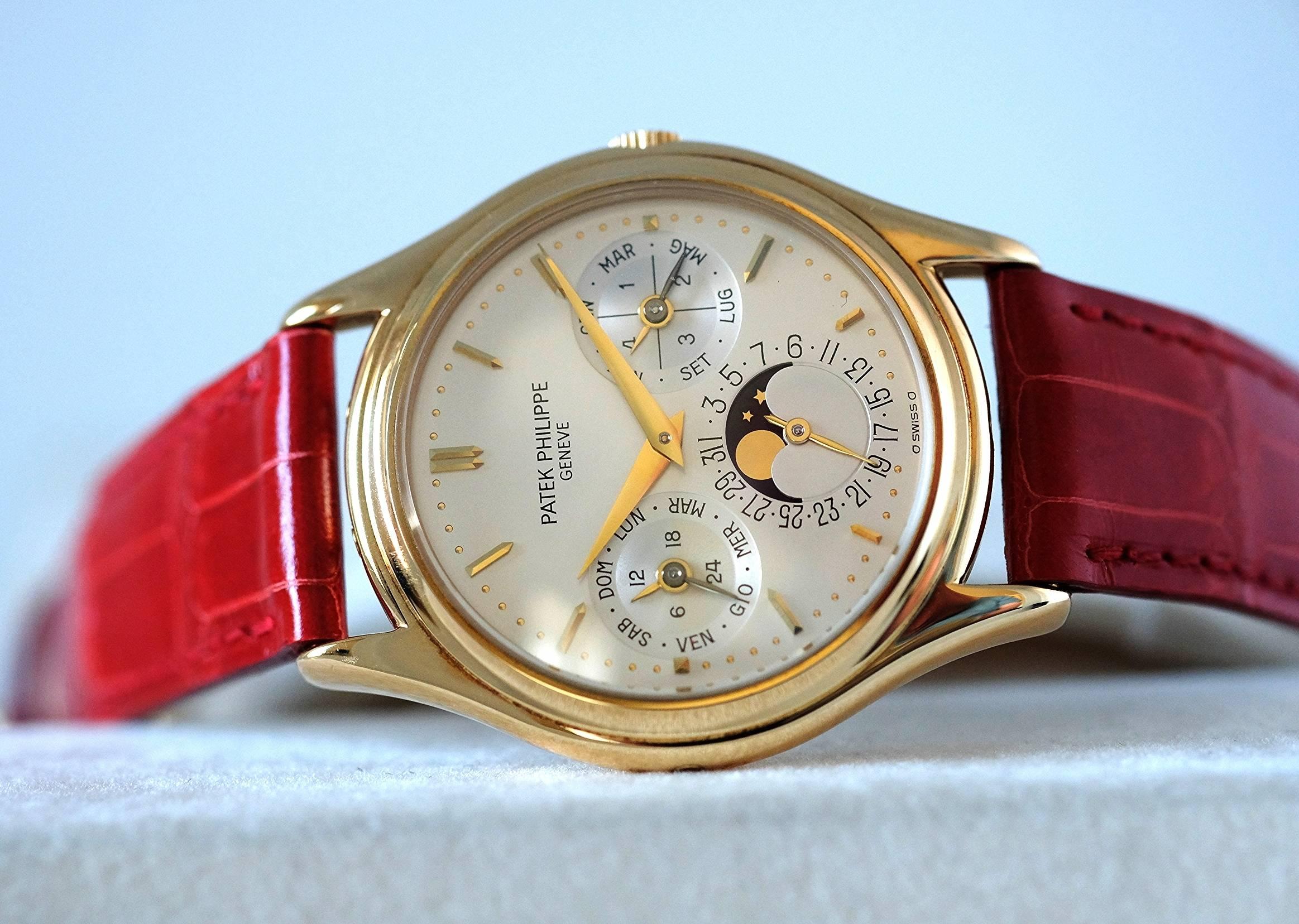 Patek Philippe Perpetual Calendar ref 3940J, in yellow Gold with Italian Calendar

Circa 1992

Case:  two-body, solid, polished, concave and stepped bezel, case is unpolished with strong hallmarks showing on side of case. Case is fitted with