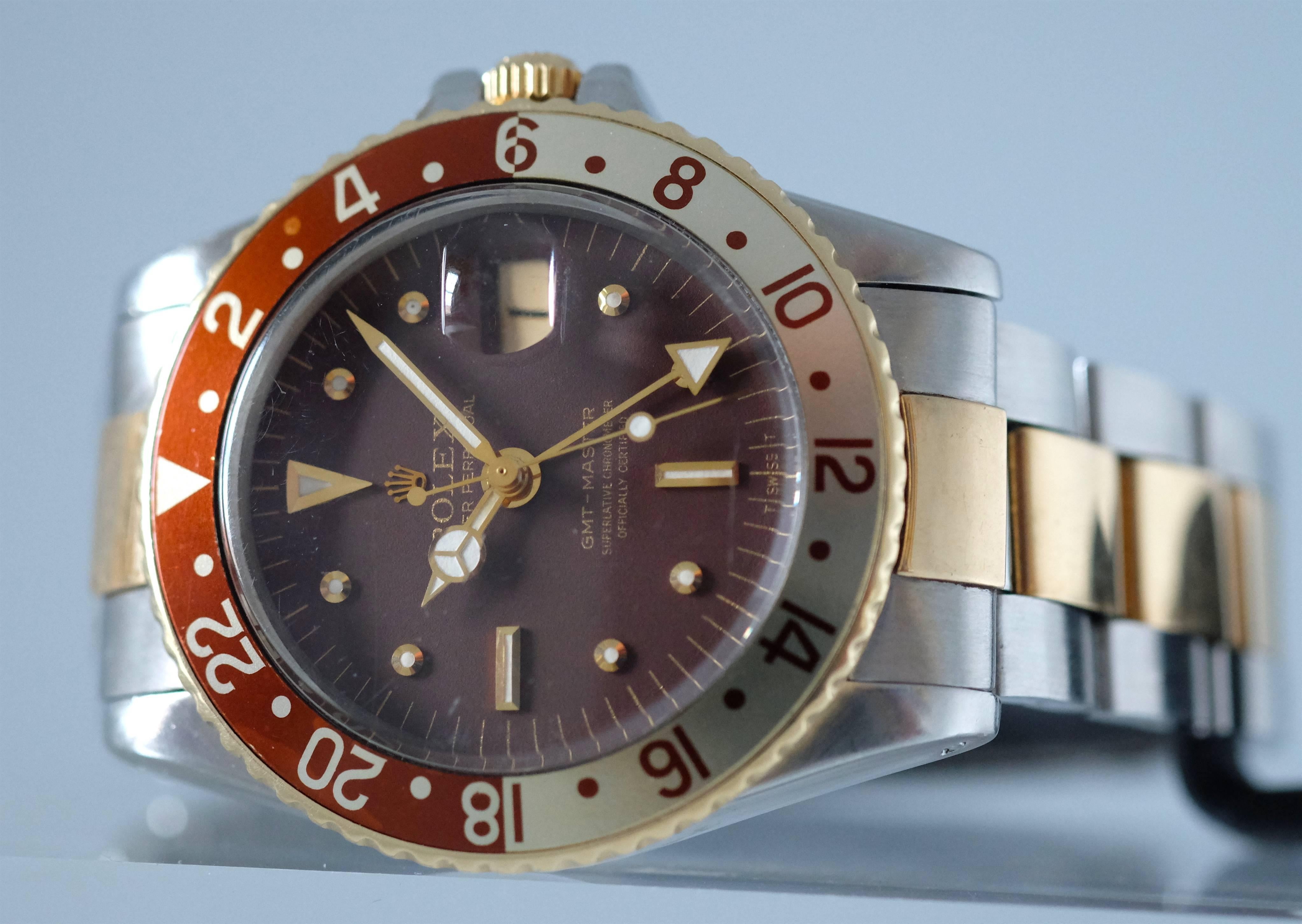 Rolex Ref. 1675 GMT-Master brown dial steel & gold,  Oyster Perpetual with 24-hour bezel and hand and a stainless steel  & Gold Rolex Oyster Fliplock bracelet with deployant clasp. 

Case: Three-body, polished and brushed, screw-down case back and