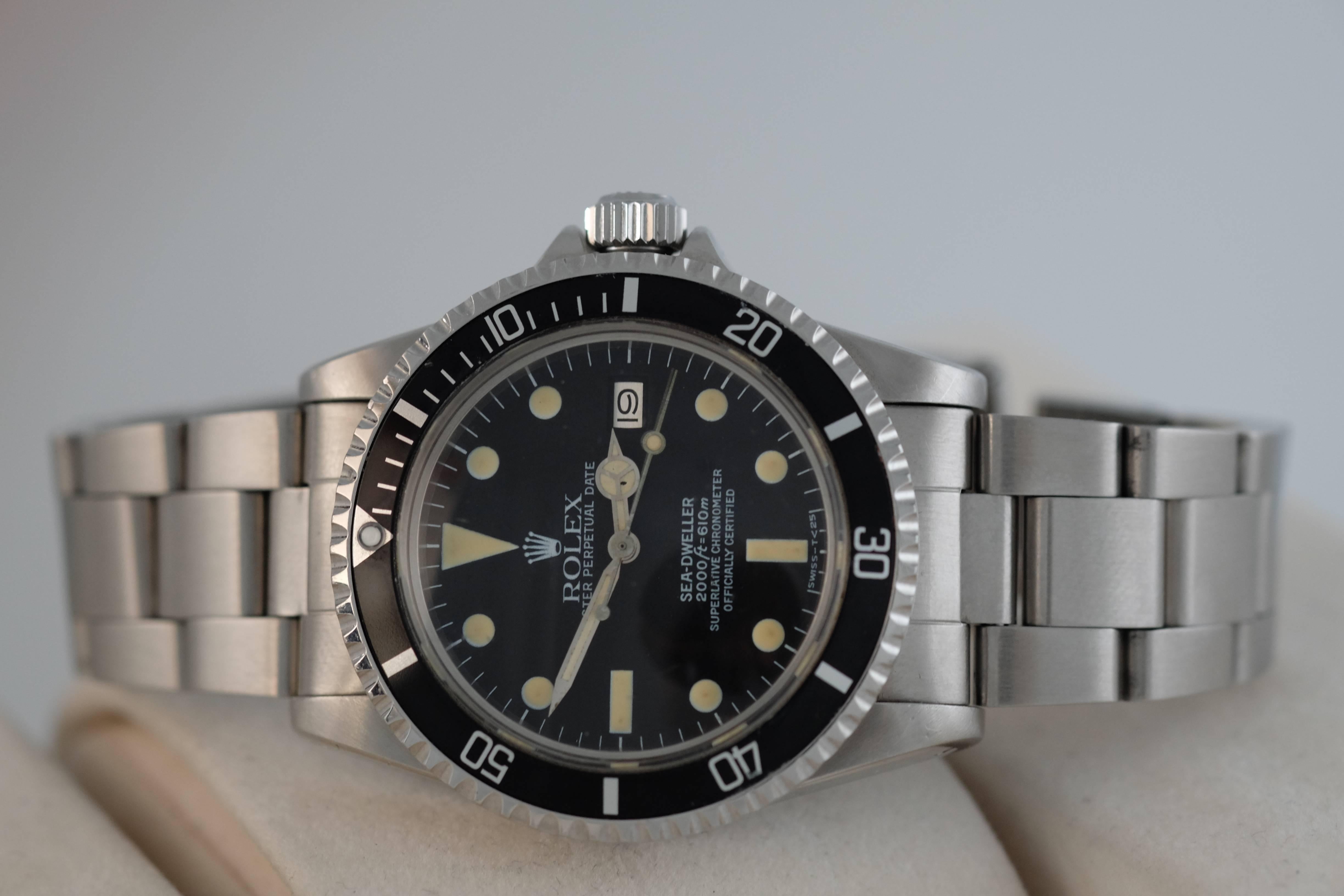 Rolex. A Stainless Steel Wristwatch with Date

Model: Sea-Dweller

Reference: 1665

Circa: 1980

Cal. 1570 automatic movement, 26 jewels, black matte dial, luminous dot, baton, and triangle numerals, luminous hands, outer minute track,