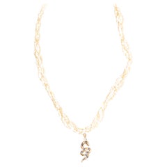 A 9ct Gold Sapphire and Diamond Snake Pearl Necklace