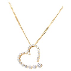 Collana vintage con ciondolo a forma di cuore in oro 18 carati e diamanti