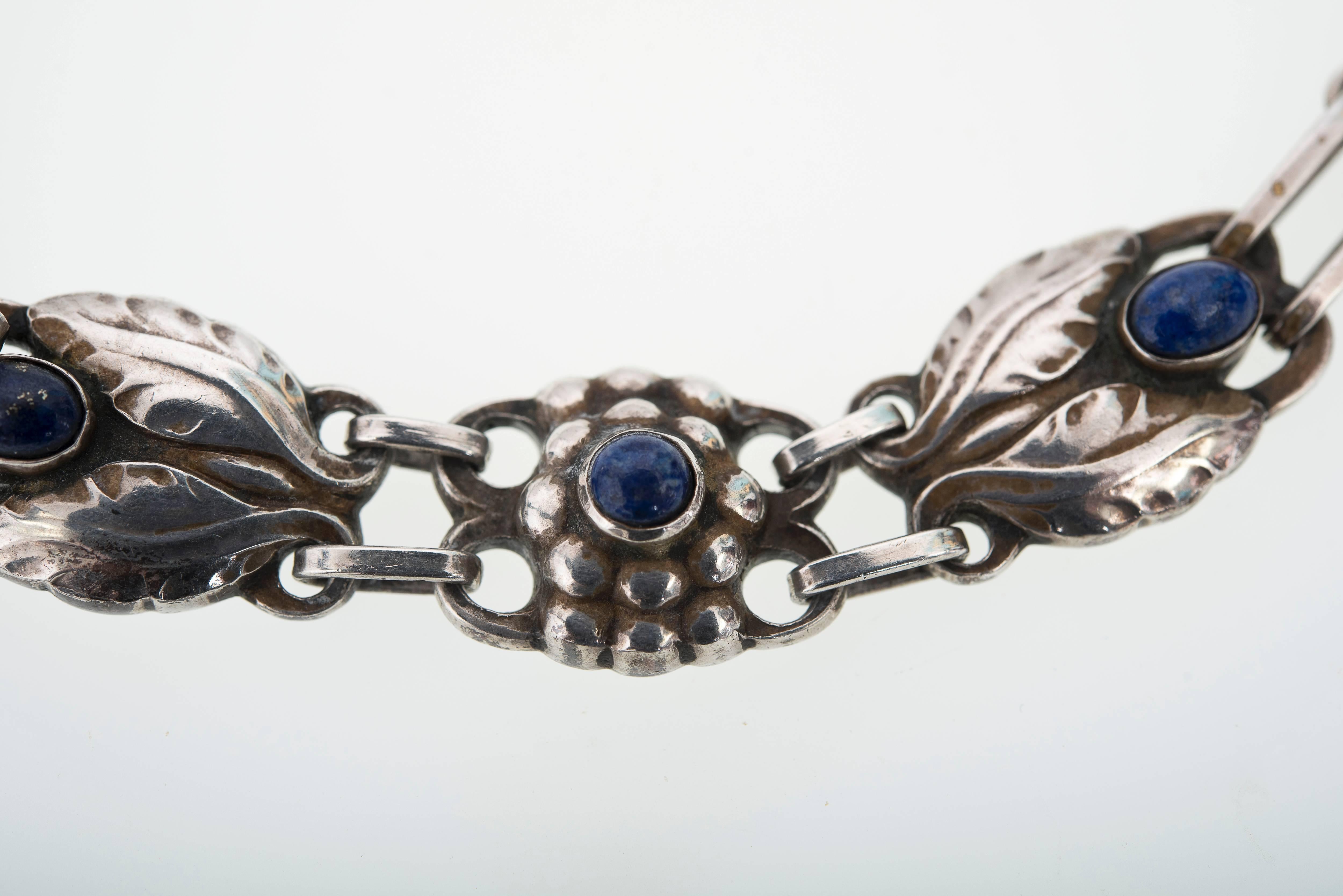 Exquisite Georg Jensen Art Nouveau necklace design #1. (1915 - 1927)
Bud and foliate motifs sets with lapis lazuli cabochons
