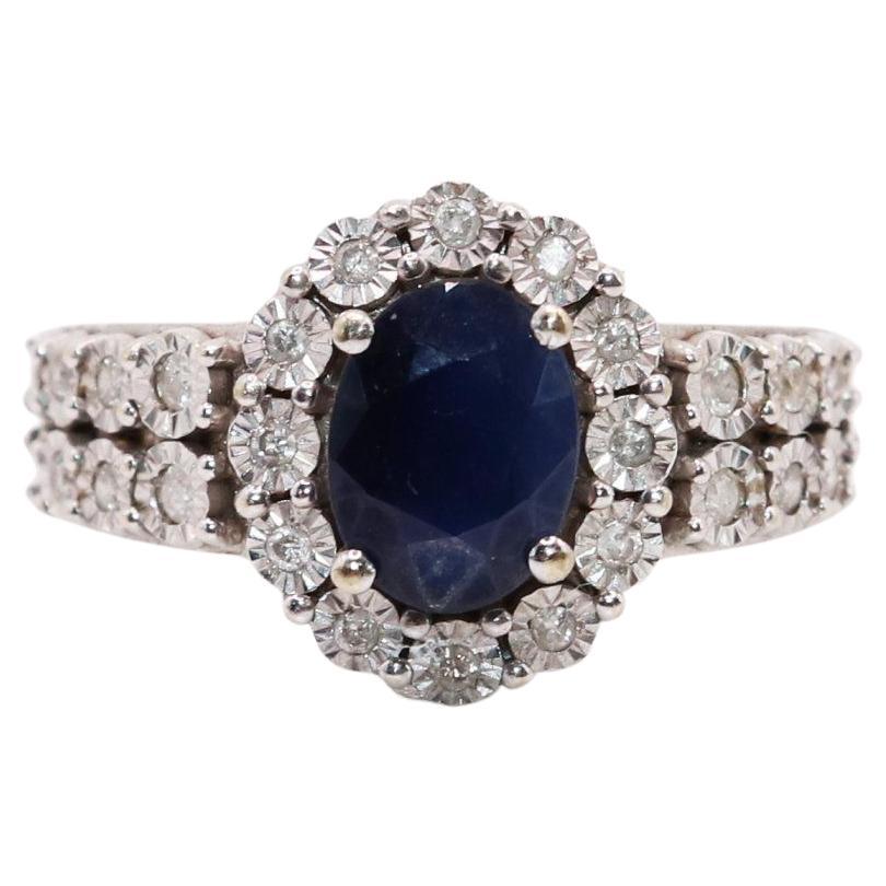 14K White gold ladies ring with oval cut sapphire and small diamond accents. Weighs 4.2 grams, size 6 1/2.
Unmarked tested for 14KG.