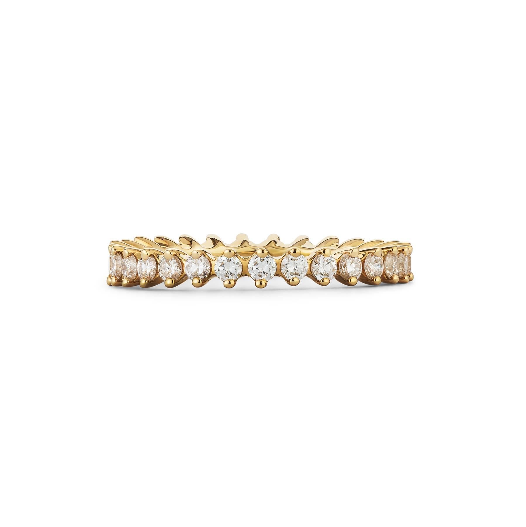 These diamond stacking rings use two claws for each diamond setting so that when they are worn together, they stack perfectly next to one another to look like one single ring.

Set in 18K white, yellow and rose gold, each ring has a total diamond