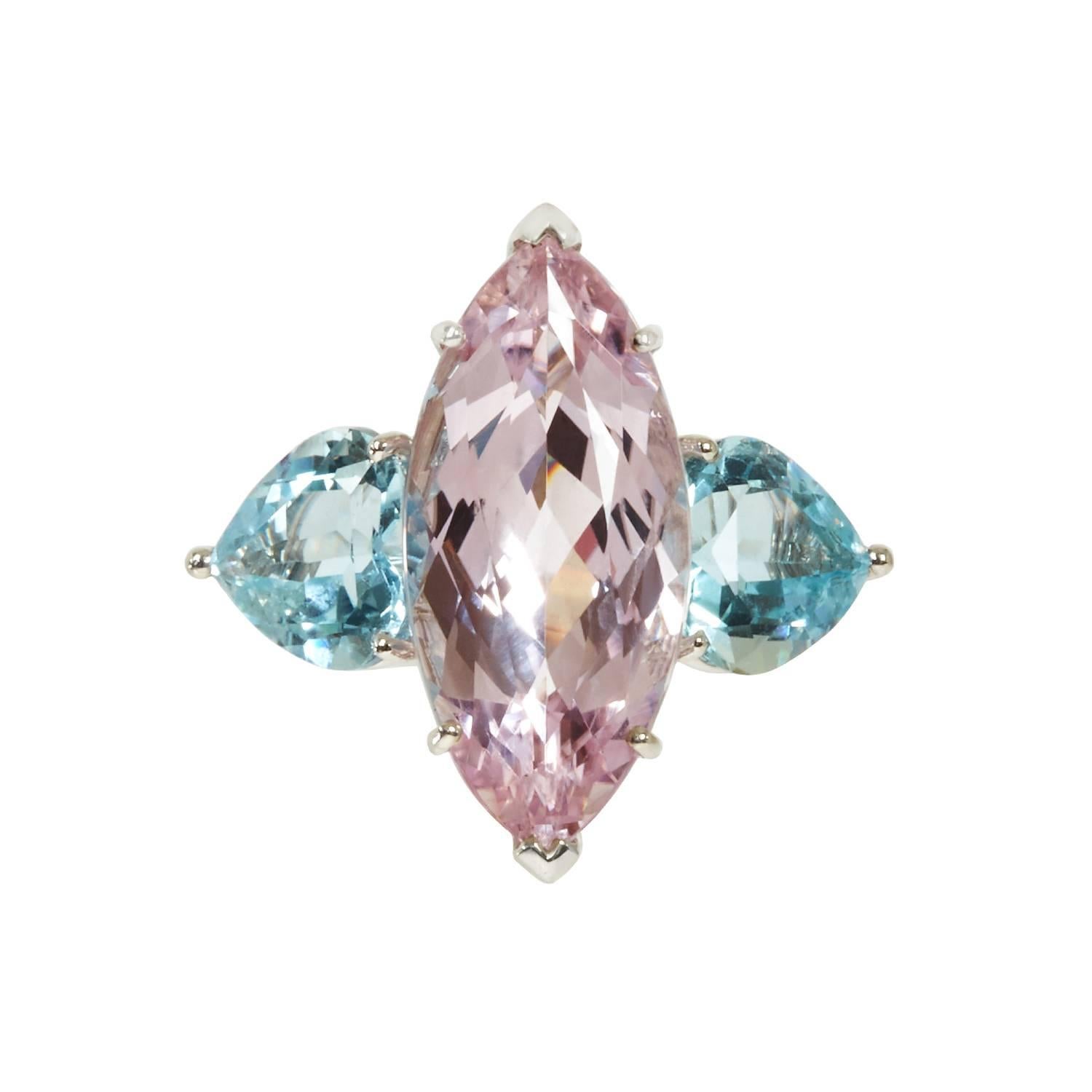 This trio ensemble features a marquise-shape kunzite and heart-shape aquamarines on each side. It's subtle and sleek design makes it perfect for any occassion, easy to style for a day or night look. 

Matching earrings are available. 

Finger
