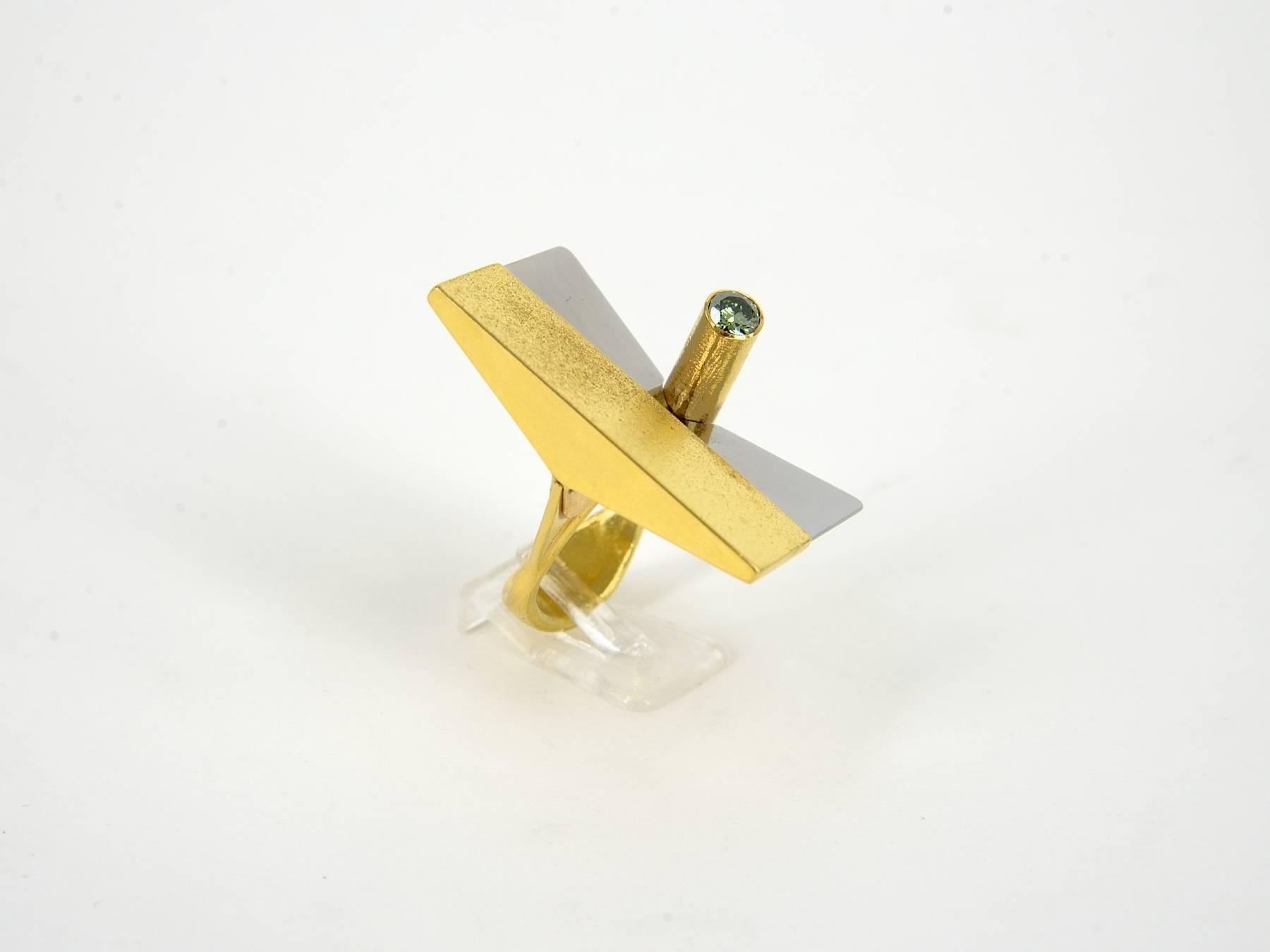 Gold and steel with a green 0.38 ct. embedded diamond ring created by Karl Heinz Reister in 1992, hand made, unique piece. 