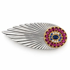 Broche « Plume » vintage Erté en or 14 carats et argent, sertie de saphirs, de grenats et de diamants