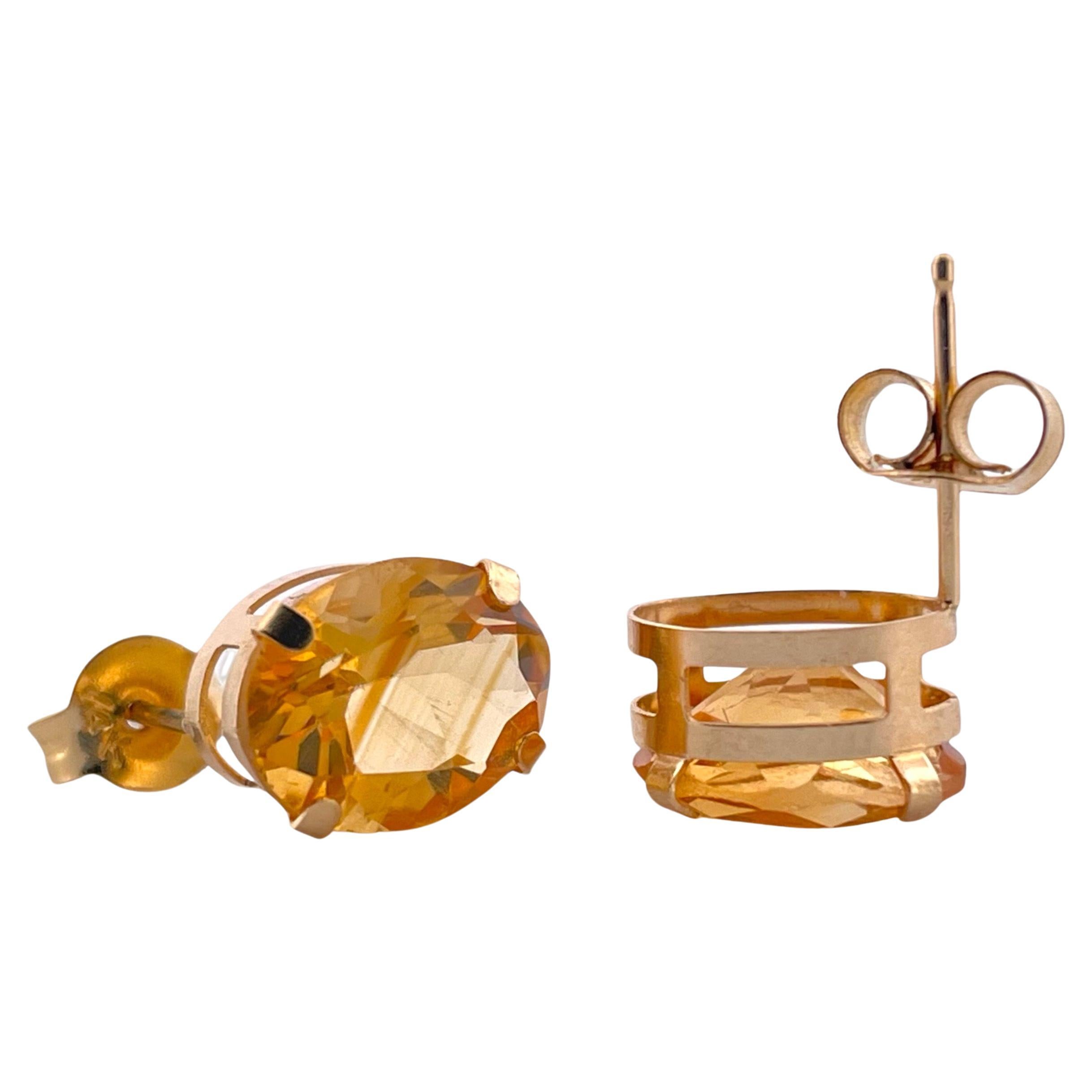 Bask in the warm, golden radiance of our Golden Glow Oval Citrine Stud Earrings, elegantly crafted from 14K yellow gold. Each stud weighs 1.33 grams and showcases a lustrous oval citrine, a gemstone symbolic of sunlight and joy. The rich yellow gold