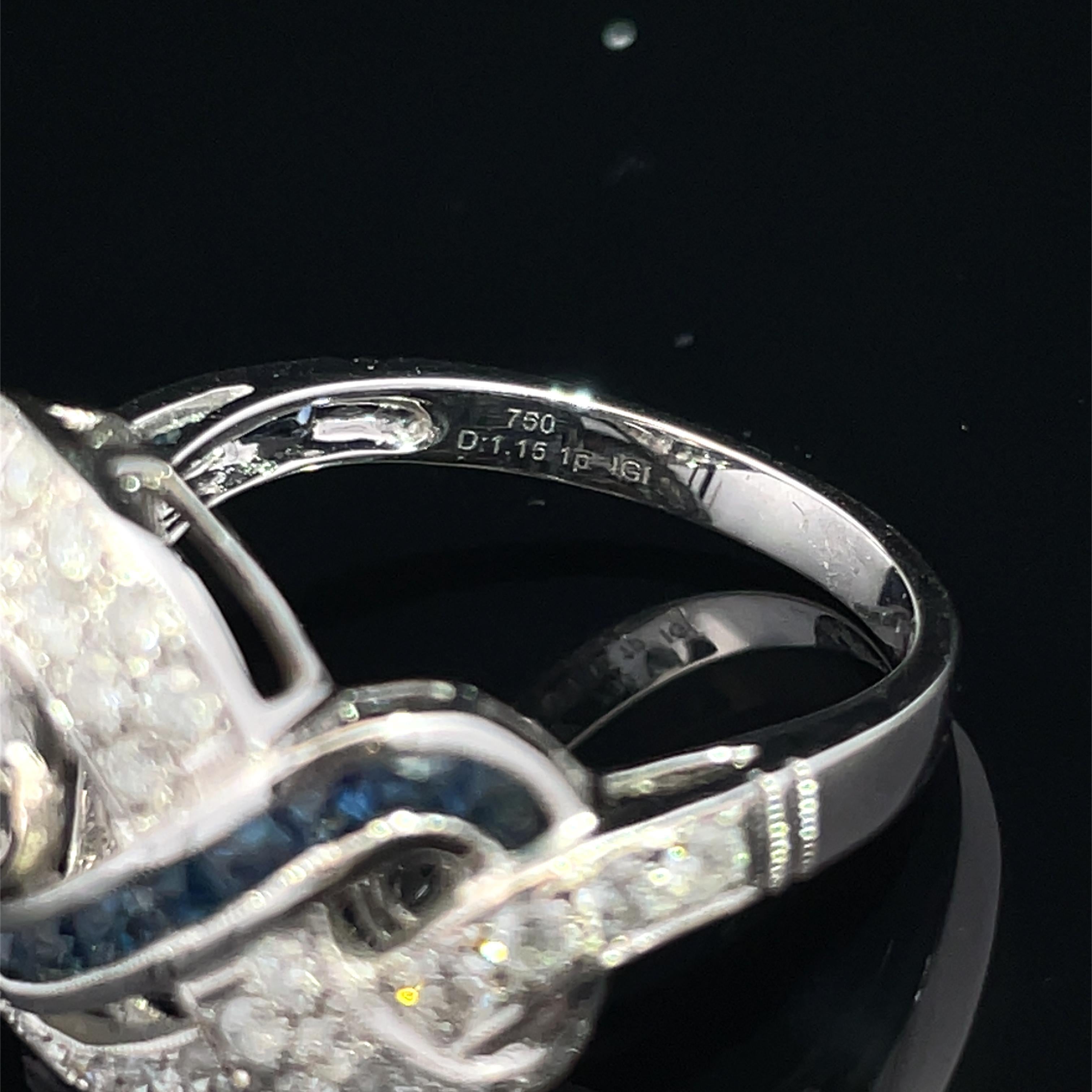 Ring aus 18 Karat Weißgold mit wirbelndem blauem Saphir und natürlichem Diamant für Damen oder Herren im Angebot