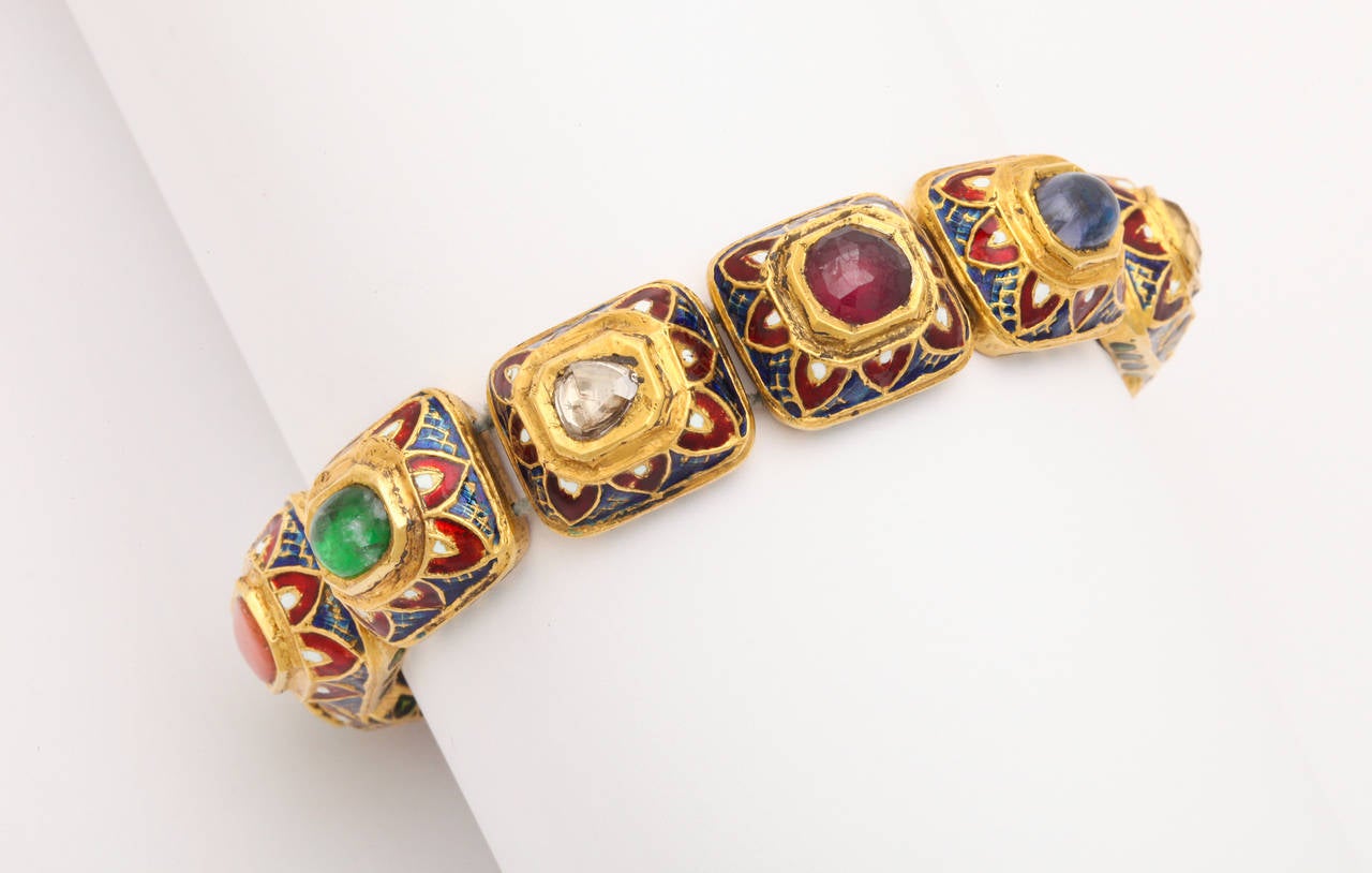 A bracelet composed of 18kt yellow gold and enamel beads. The beads are set with: ruby, pearl, citrine, sapphire, garnet, diamond, emerald, coral, cats eye chrysoberyl and turquoise.