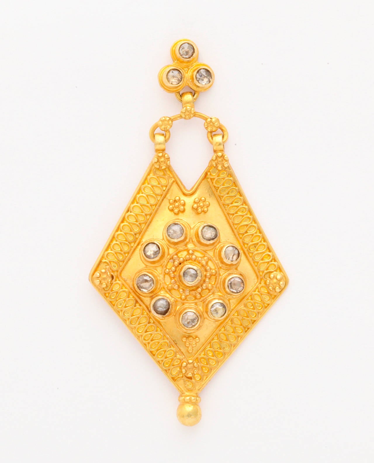A pair of 18kt yellow gold and rose cut diamond shield earrings. There are approximately 1.30cts of diamonds.
Height: 2 inches
width: 1:00 inch