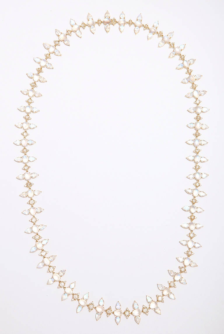 An 18kt yellow gold necklace composed of faceted and cabochon moonstones and rose cut and round brilliant cut diamonds. There are 109.28cts of moonstones and 11.18cts of diamonds.