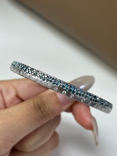 0.47 Carat White diamonds and 1.45 Carat Blue Diamonds in 14K WG Bangle