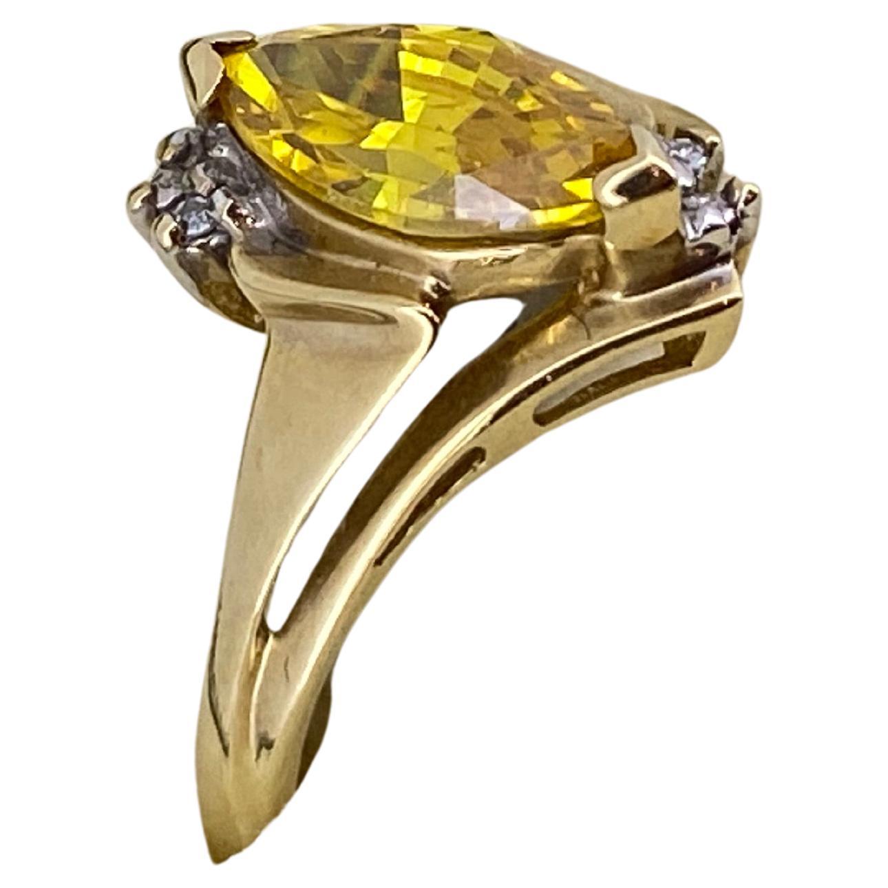 14K Yellow Gold Dress Ring,
set with 1.50 ct marquise shaped Golden Zirconia &
adorned with round brilliant cut diamonds

Ring's size: N (can be resized)
Total item's weight: 2.6gr.

Comes with box & valuation
