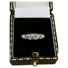 An Art-Deco Style 5-Stone Half-Hoop 0.65ct Diamond Ring. English hallmarks.