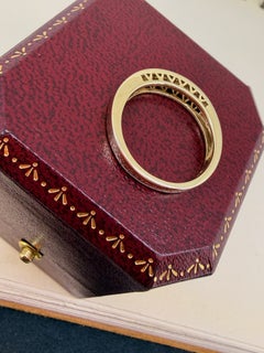 Superbe bague / alliance en or jaune 9 carats sertie d'un diamant de 0,80 ct taille baguette (sertissage en rail)