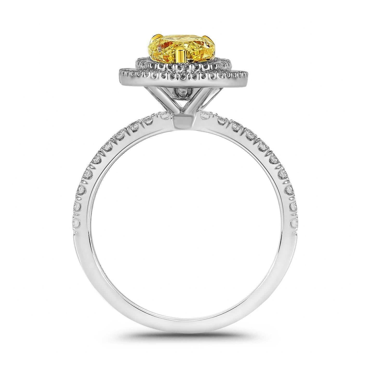 We present this striking, Diamond Engagement Ring skillfully crafted from 14K gold symbolizing everlasting love and commitment!  

The center stone carried on this piece is a 1.46ct Fancy Yellow Pear Shape GIA certified diamond with SI1 clarity. 
