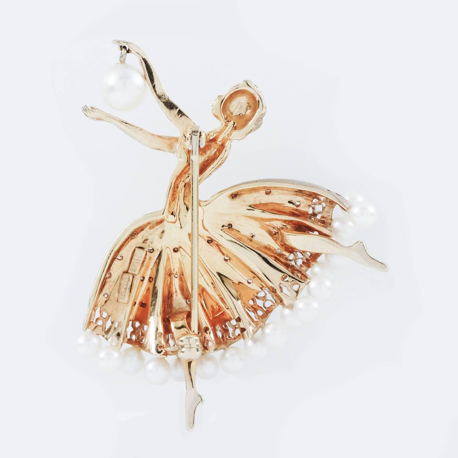  Gold, Cultured Pearl and Diamond Ballerina Brooch, Tiffany & Co. 
14 kt., pearls ap. 6.6 to 3.9 mm., signed Tiffany, ap. 11.2 dwts. 

C Property of a Lady

Condition Report: Overall in good condition, light wear to metal. 

Diamonds: