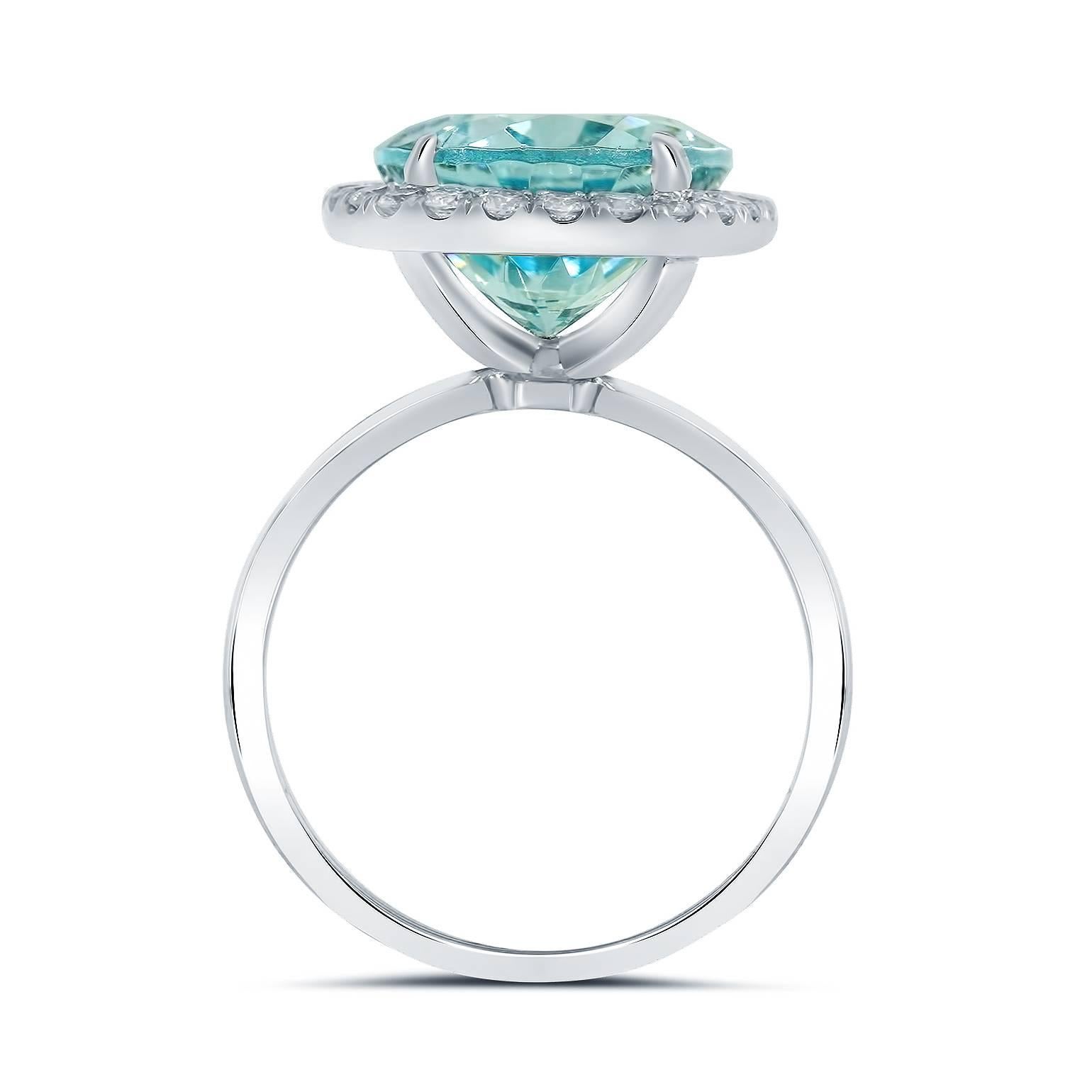 We present this striking, Aquamarine Halo Engagement Ring skillfully crafted from Platinum symbolizing everlasting love and commitment!

The center stone carried on this piece is a 5.37 carat Oval Shape Aquamarine Gemstone.

Accenting this