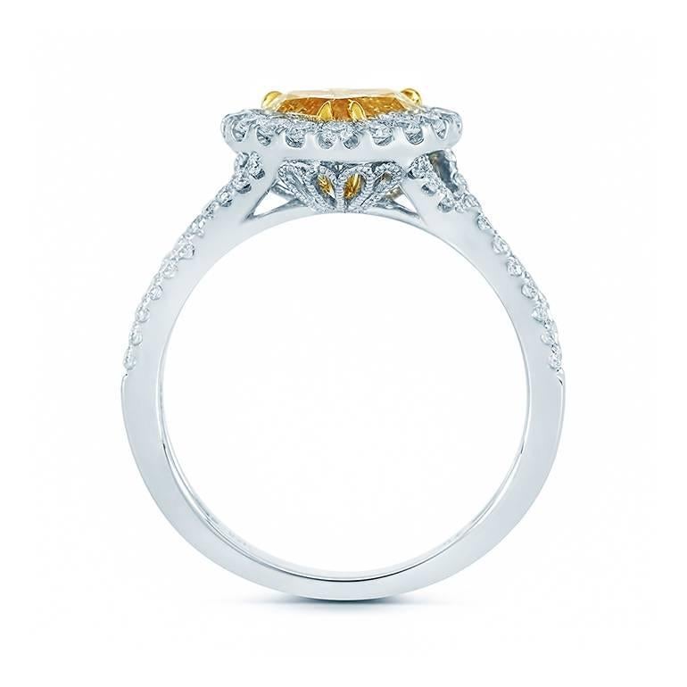We present this striking, Diamond Engagement Ring skillfully crafted from 18K gold symbolizing everlasting love and commitment!

The center stone carried on this piece is a 1.27ct GIA Certified Heart shape diamond with Fancy Yellow color and SI2