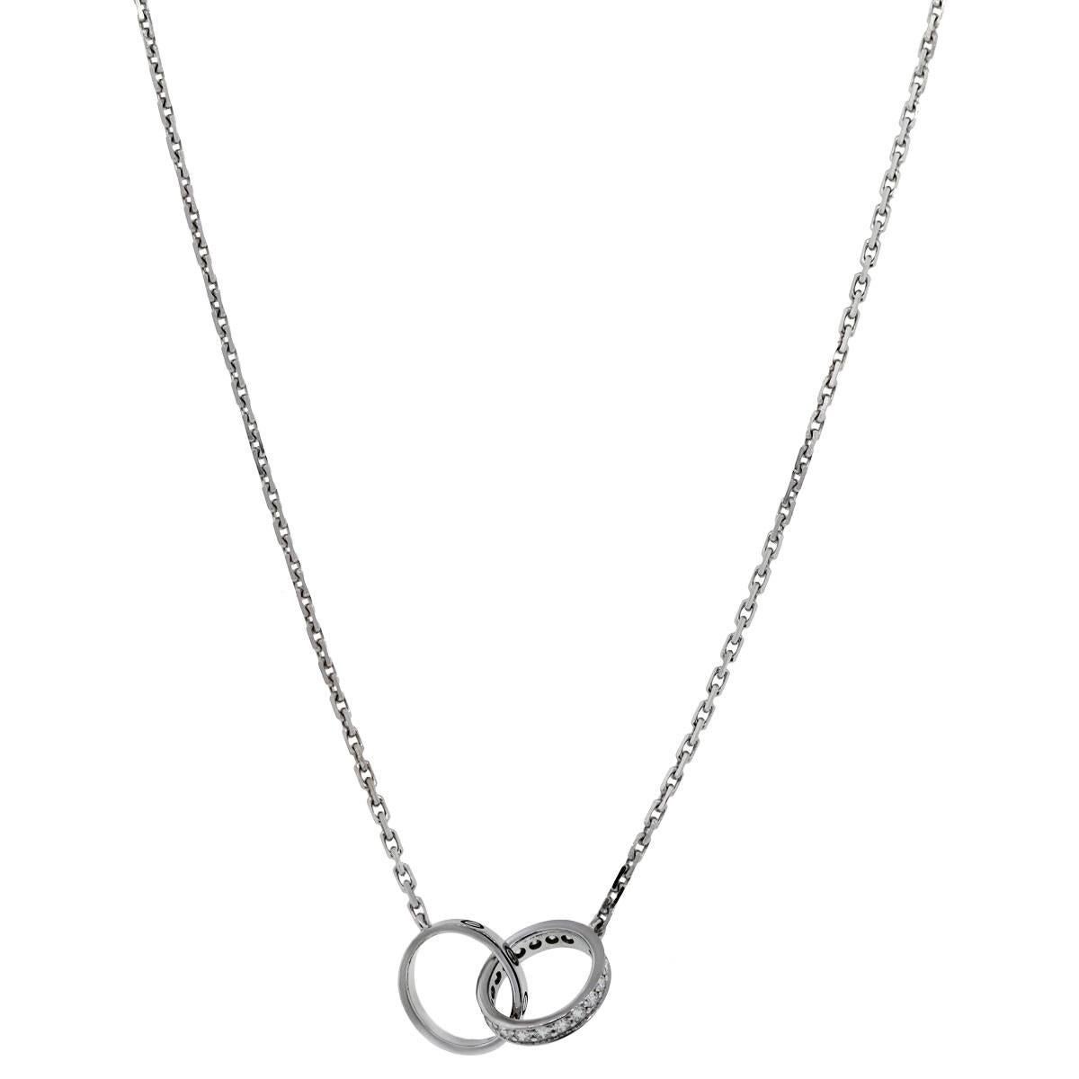 Style: Cartier 18k White Gold & Diamond Baby Love Necklace
Material: 18k White  Gold
Pendant Measurements: 2 Circles, each are approximately 0.38