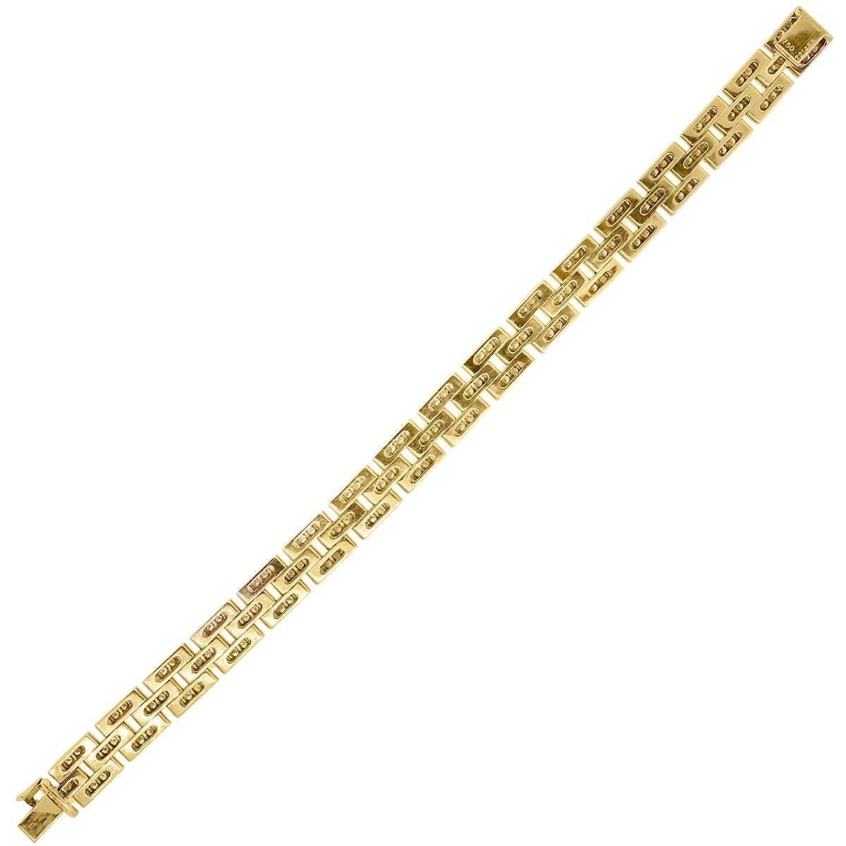 Brand	Cartier
Material	18k Yellow Gold
Diamond Details	Approximately 2.69ctw of round brilliant diamonds.  Diamonds are E-F in color and VS in clarity.
Measurements	fits 7.5